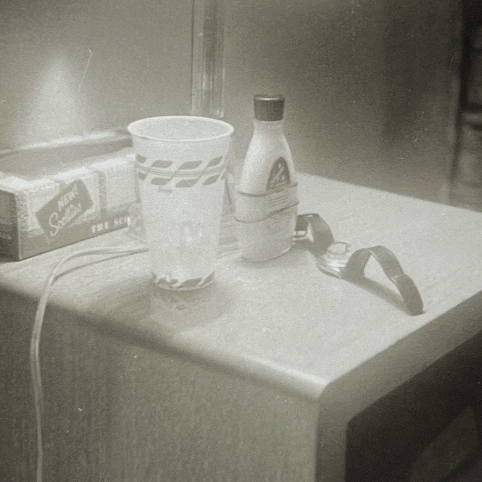Vintage B&W Snapshot Photograph Abstract Nightstand Odd Cup Watch Tissues 1950s