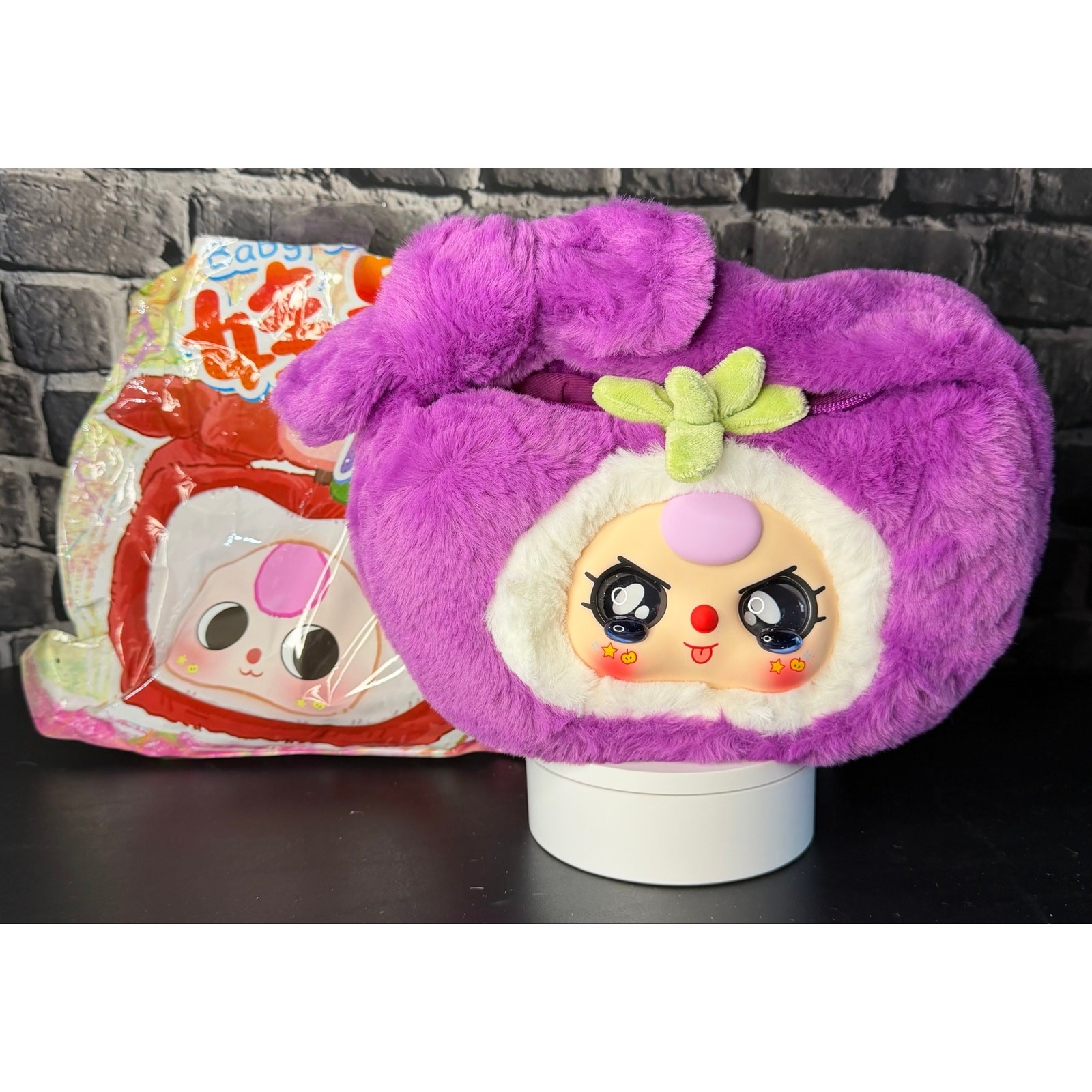 Confirmed: Baby Three Baby Fruit Handbag: Purple Plush Zipper Handbag.
