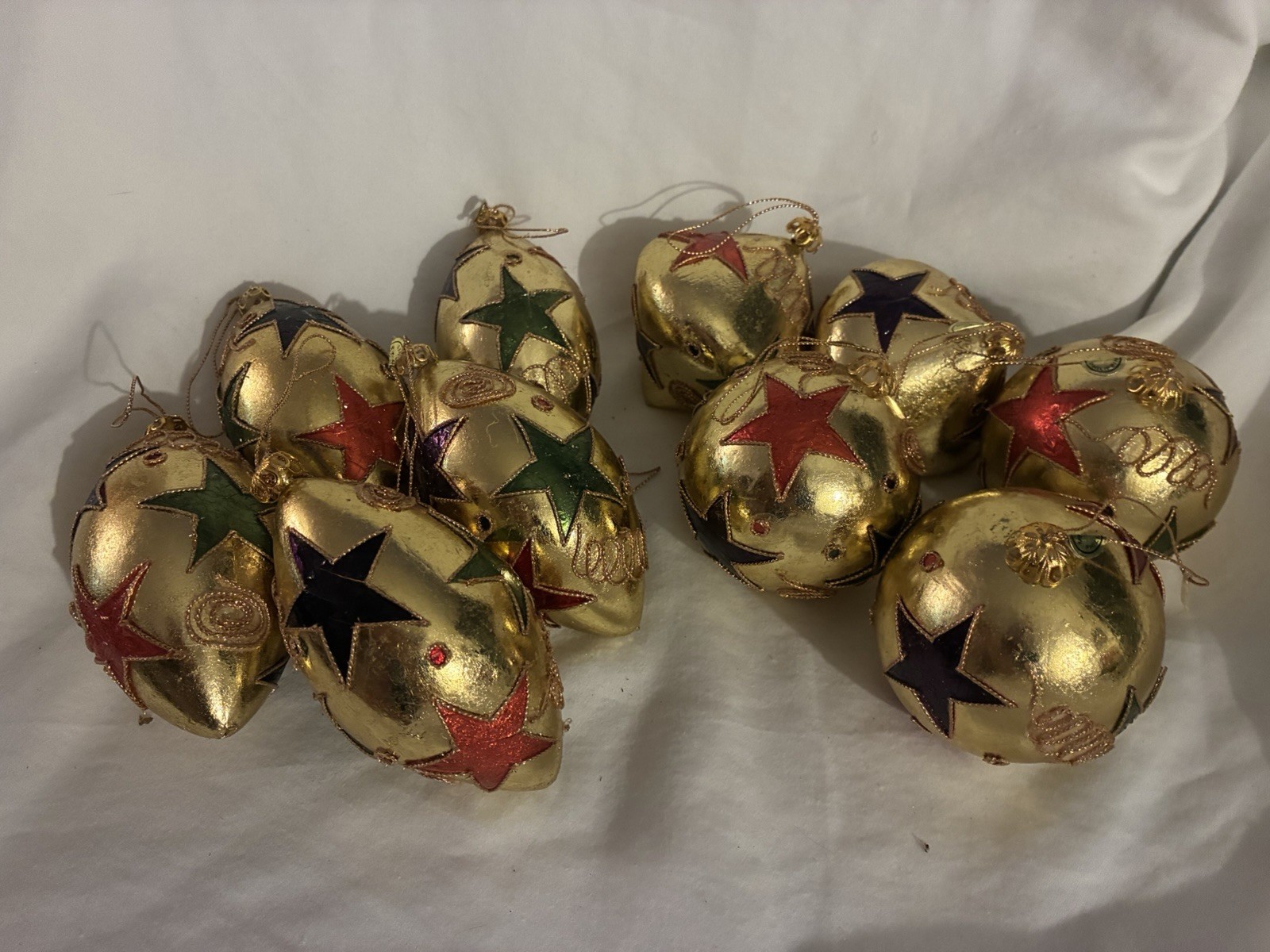 Set Of 10 Vintage Gold Metallic Ornaments With Star Accents.  