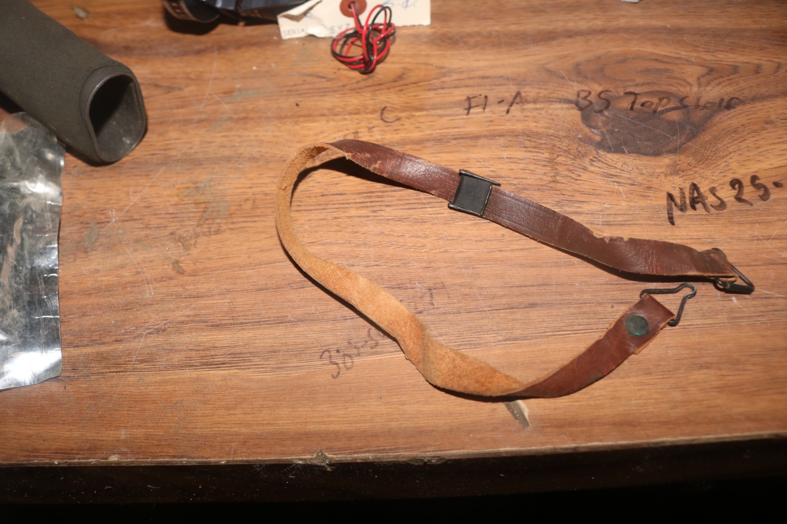 Near mint WWII USGI M-1 helmet liner leather chinstrap