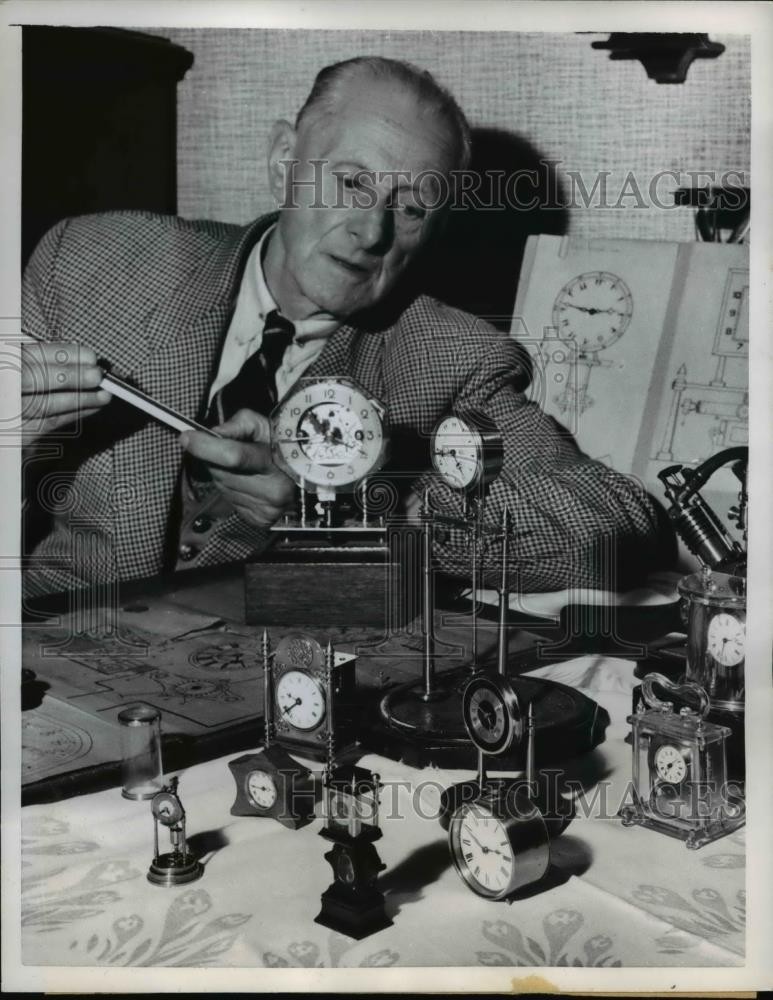 1959 Press Photo of S.J. Wise with his model timepieces. - nee07201