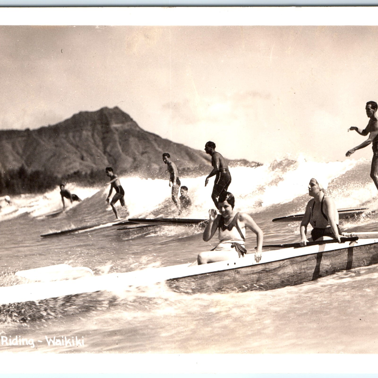 c1940s Waikiki Beach RPPC Surf Riding Surfers Outrigger Canoe Hawaii Postcard