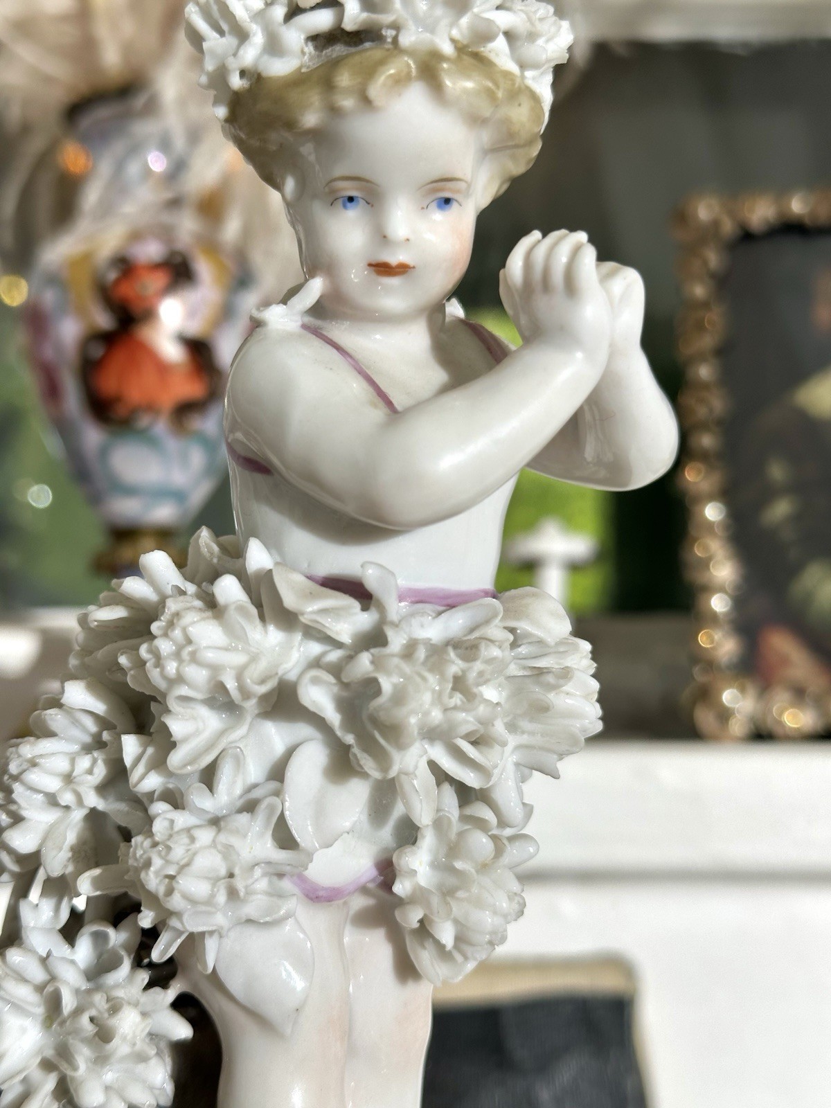 Antique Porcelain Spring Cherub Putto Child with Applied Florals Sitzendorf