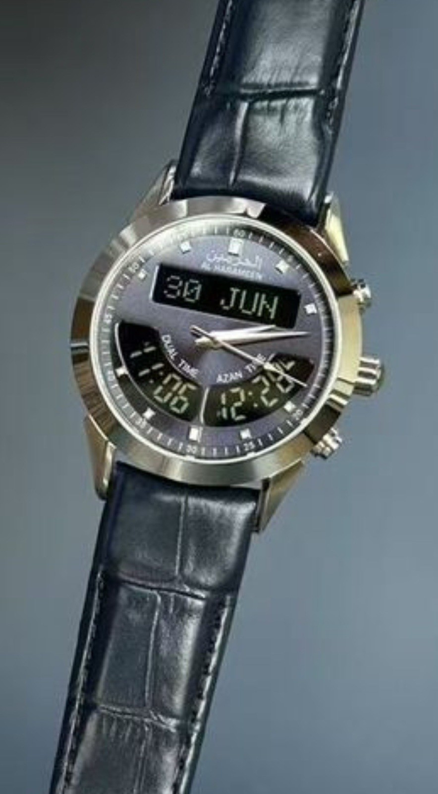 Stylish Azan watch with dual time, Qibla, calendar, and blue leather strap.