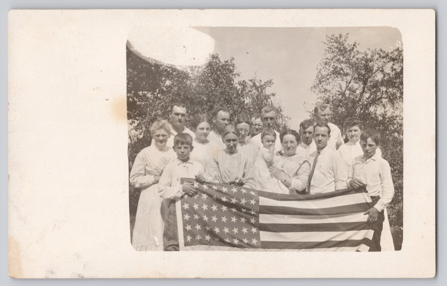 RPPC Family Group Portrait w/ 48 star American Flag Vintage Patriotic Postcard