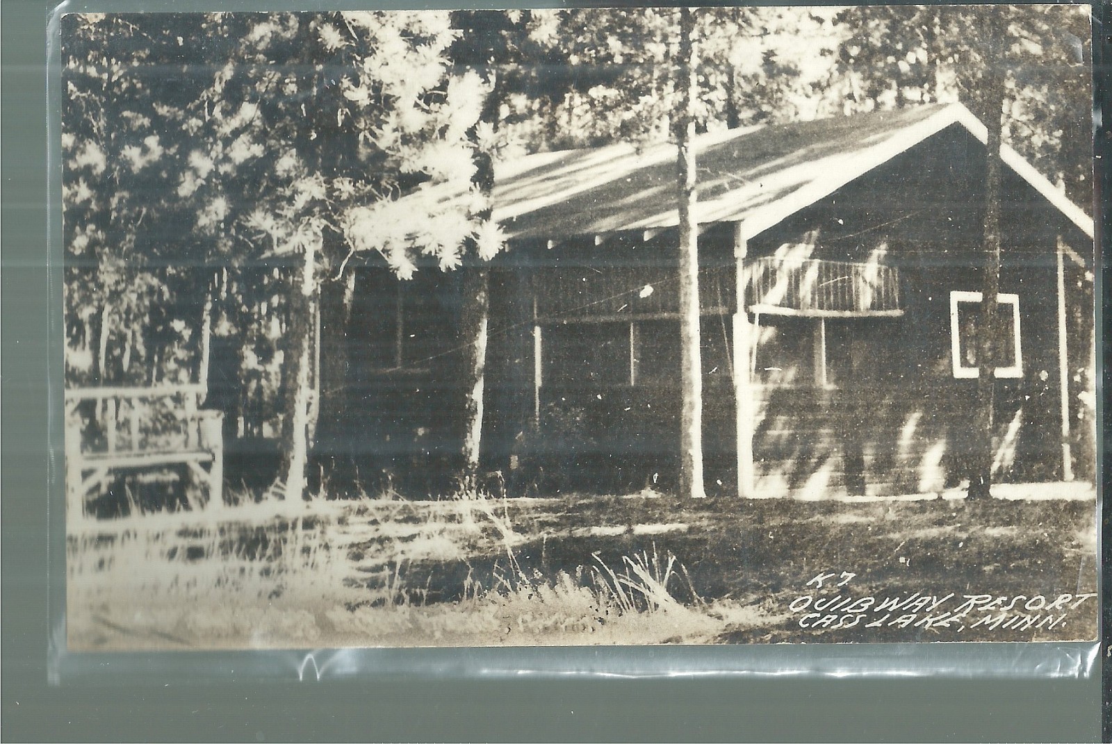 NICE RPPC VIEW OF A COTTAGE AT THE OJIBWAY RESORT ON CASS LAKE, MN