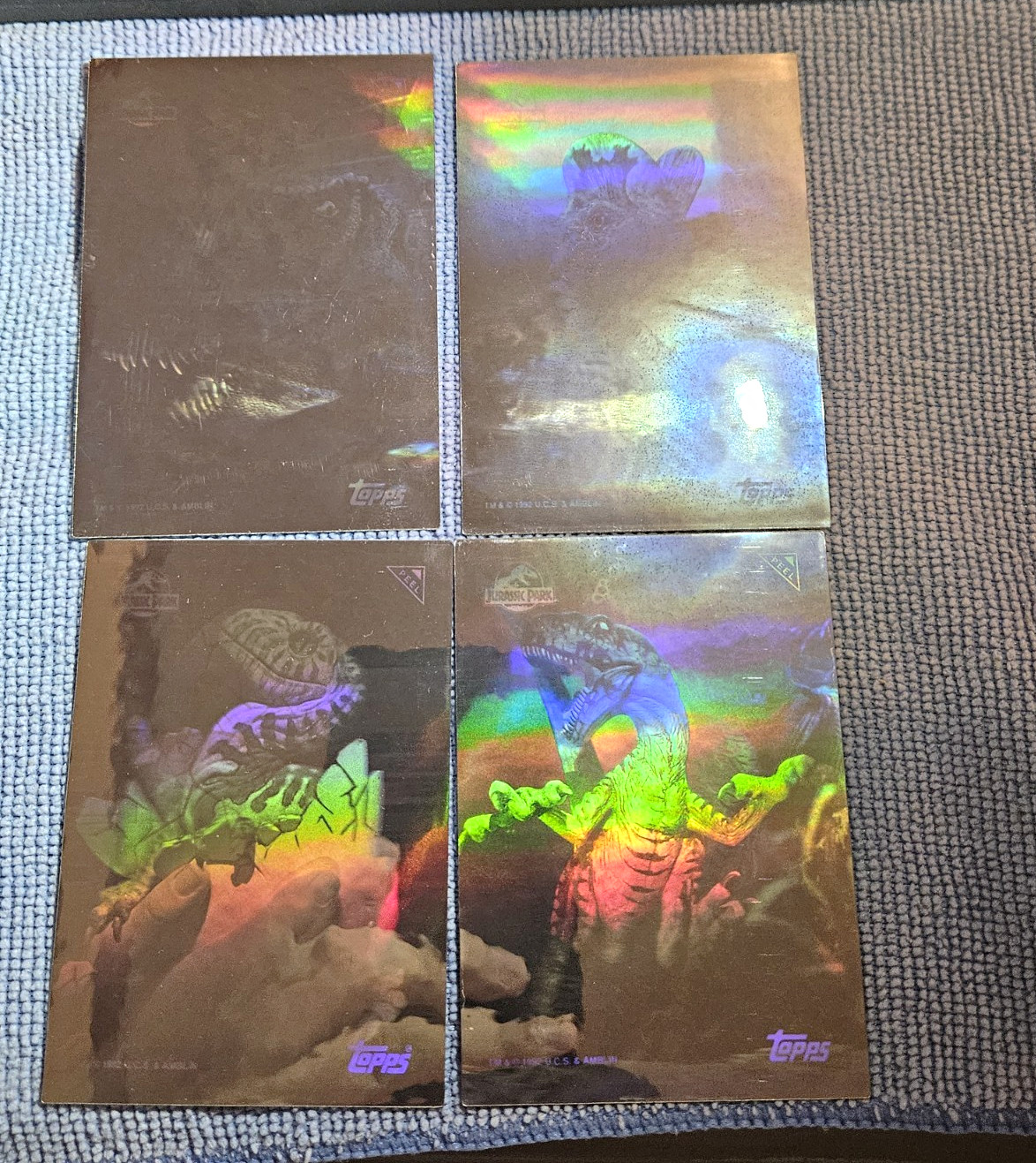 Complete set of 4 1993 Topps Jurassic Park Action Hologram cards, numbered 1–4