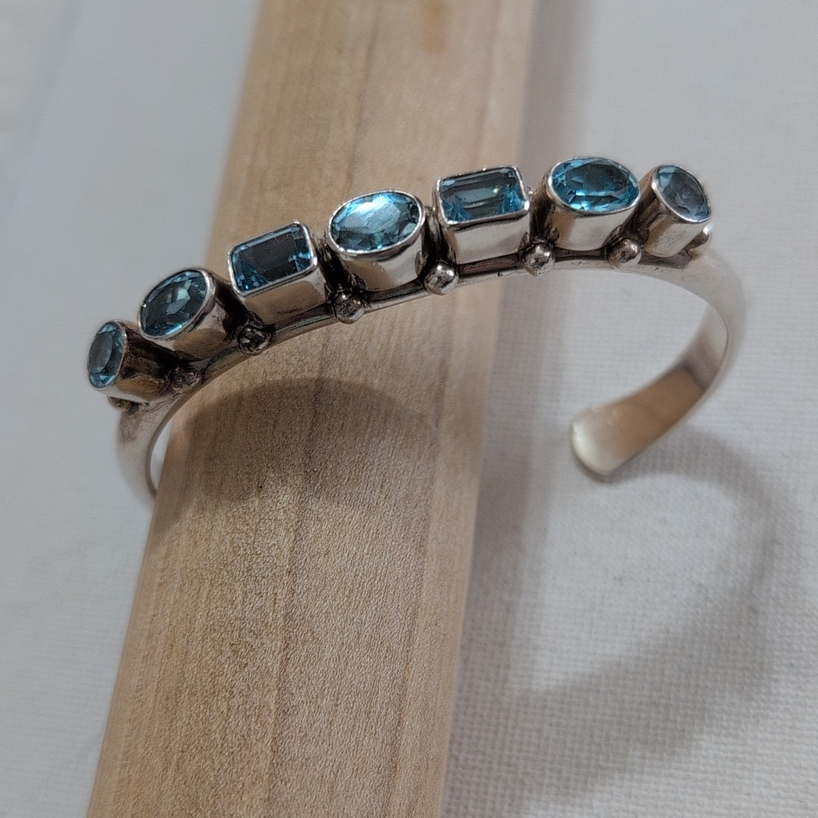 Navajo handmade 7 stone blue topaz cuff bracelet.  Stamped sterling.