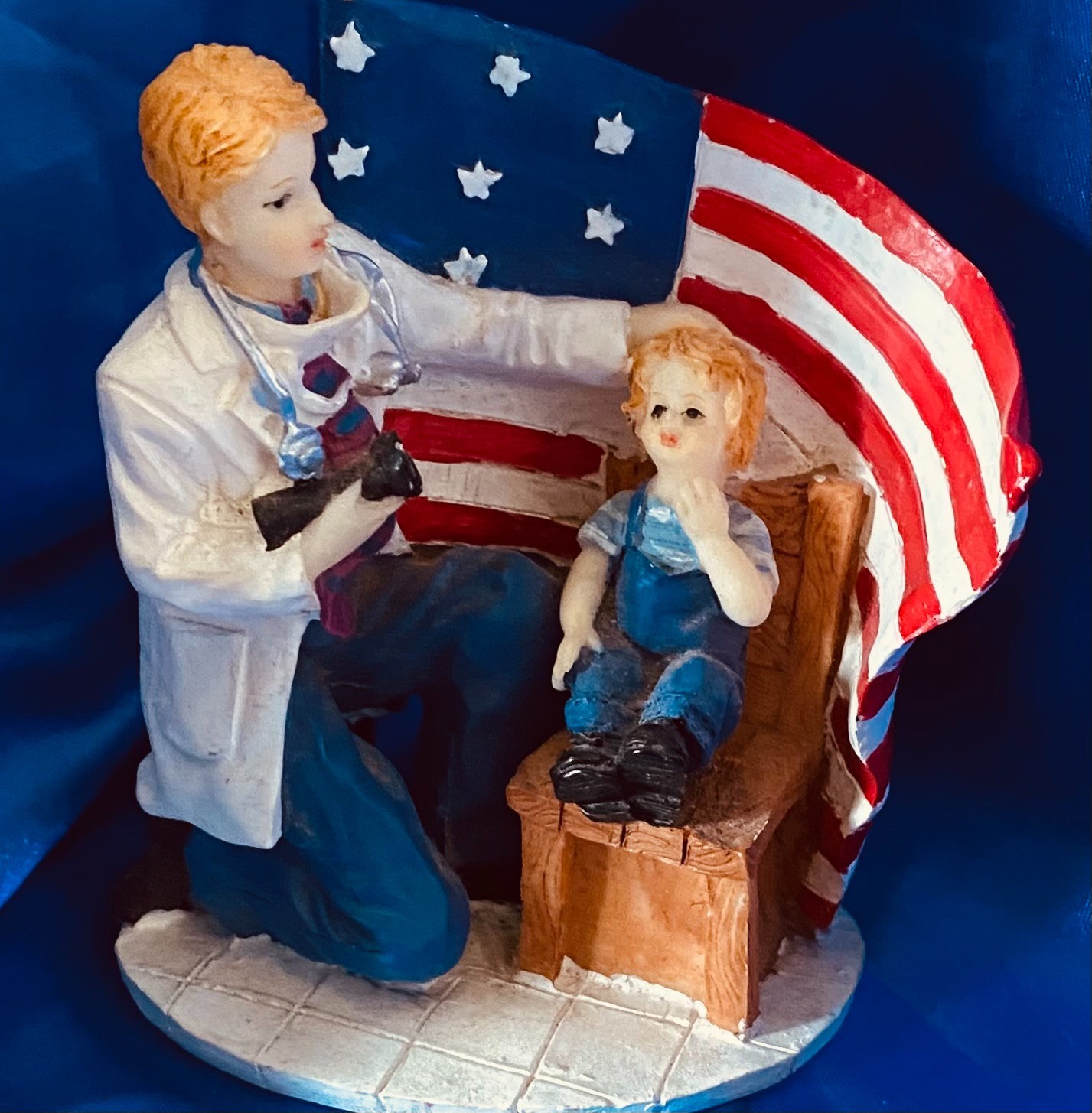 VINTAGE RED WHITE & BLUE PATRIOTIC AMERICAN FLAG FIGURINE DOCTOR W/CHILD