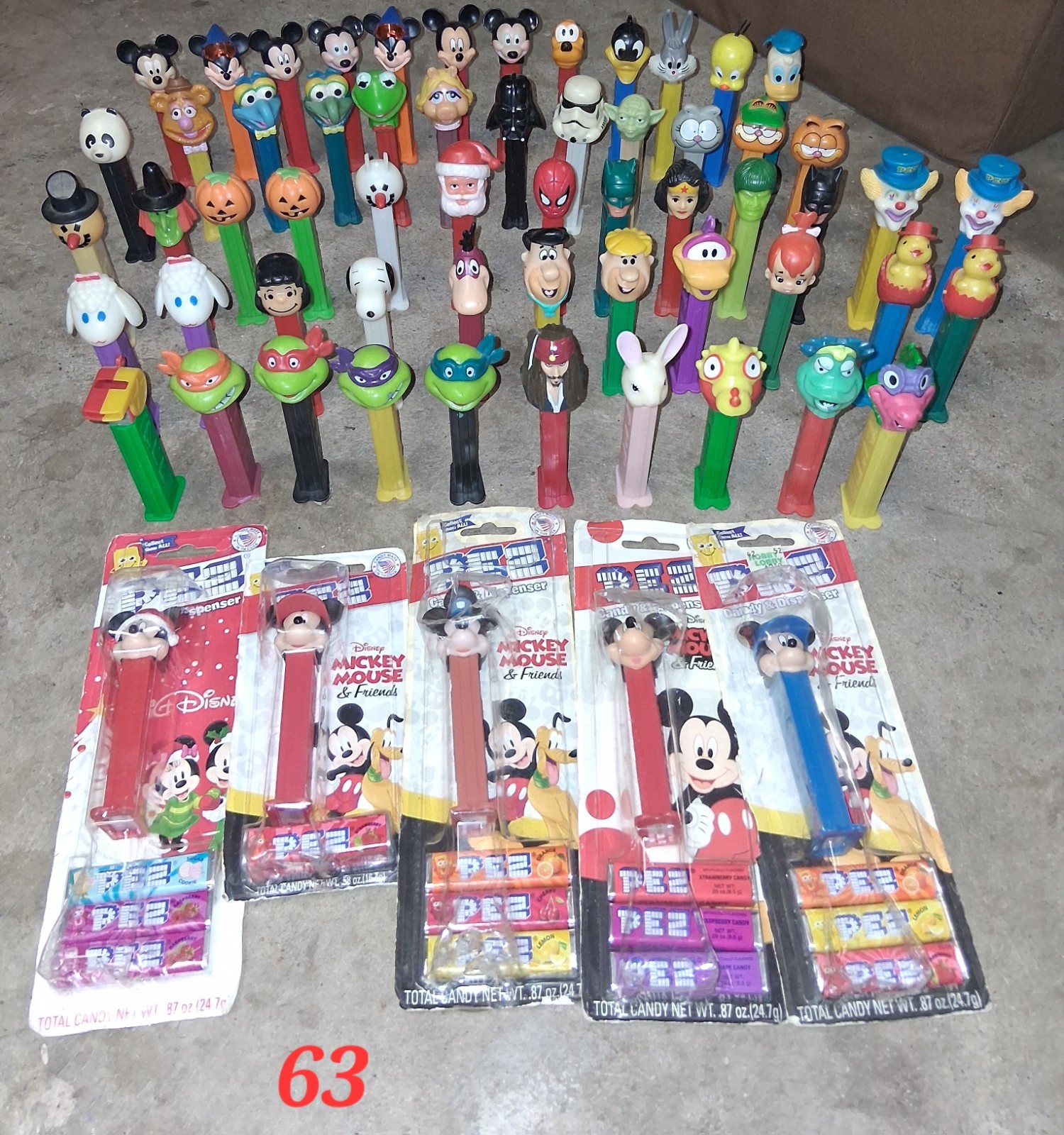 Lot Of 63 PEZ Dispensers With Feet Cartoons, Action Heroes, Holiday Characters