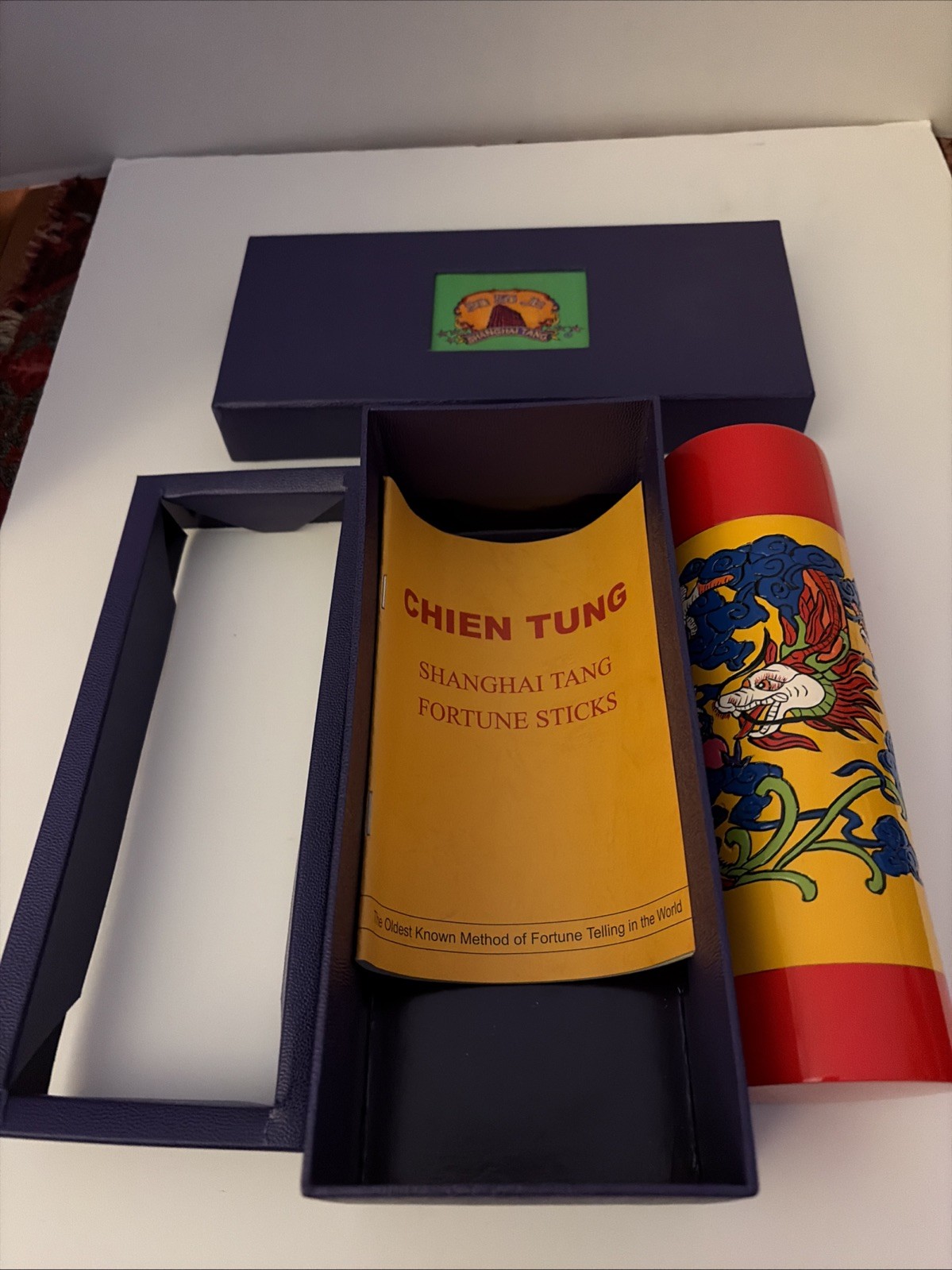 A branded Chien Tung fortune sticks set with box by Shanghai Tang.