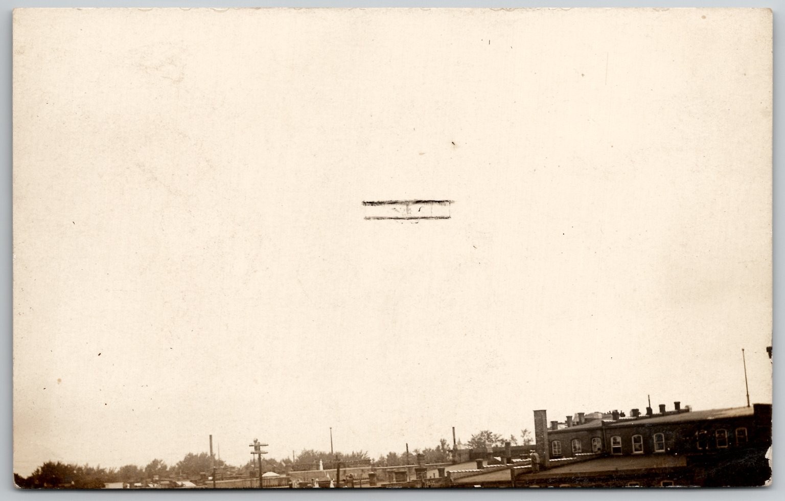 Vintage RPPC Biplane Airplane Flight Over Town Real Photo Postcard