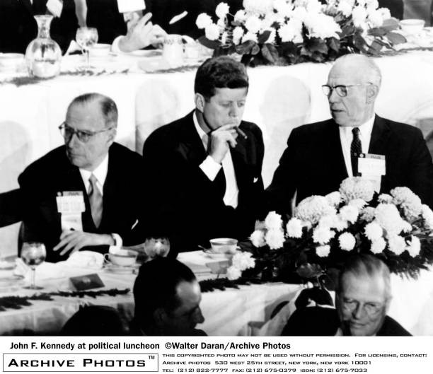 American politician John F Kennedy smoking a cigar a political lun- Old Photo