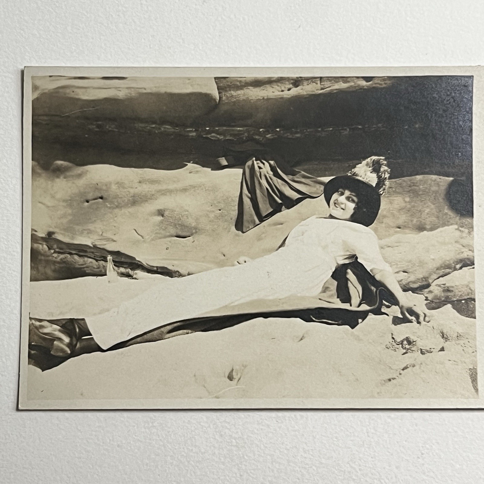 Antique RPPC Real Photograph Postcard Beautiful Young Woman Laying In Sand Hat