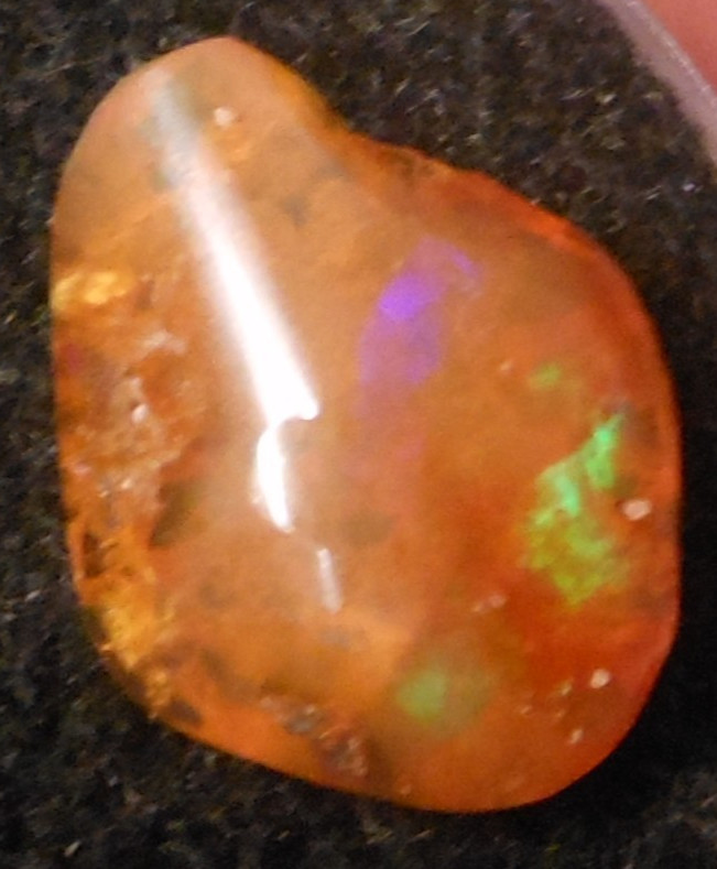 4.60ct Orange Mexican Fire Opal Blazing Greens and Purples 16mm x 12.6mm x 5.2mm