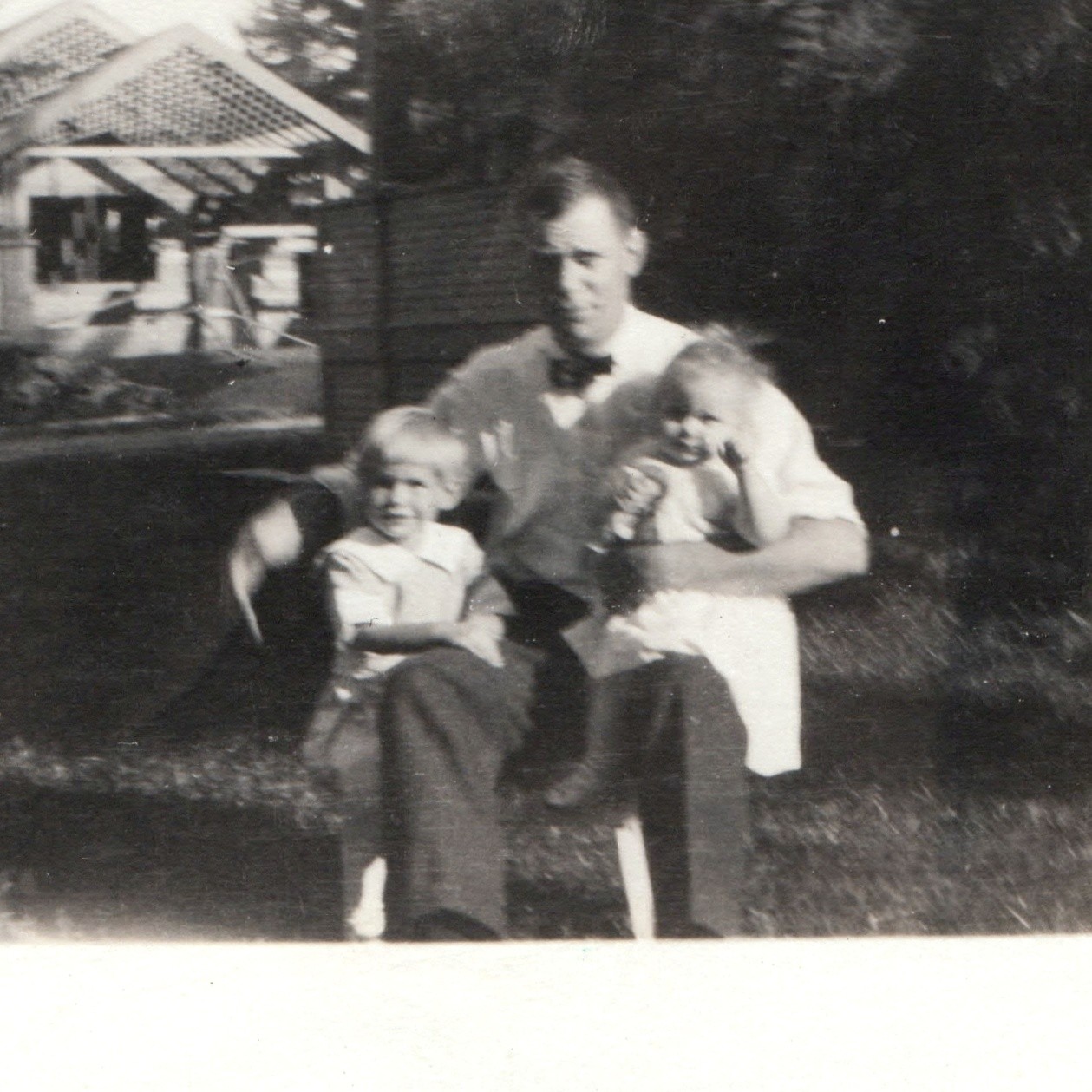 c1920s Father Holding Two Children RPPC Bowtie Sitting Lawn Garden Pergola House