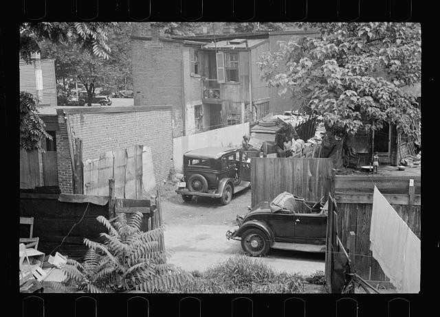Photo:1930s Slum Housing Automobiles Clotheslines Laundry Fenced Yard