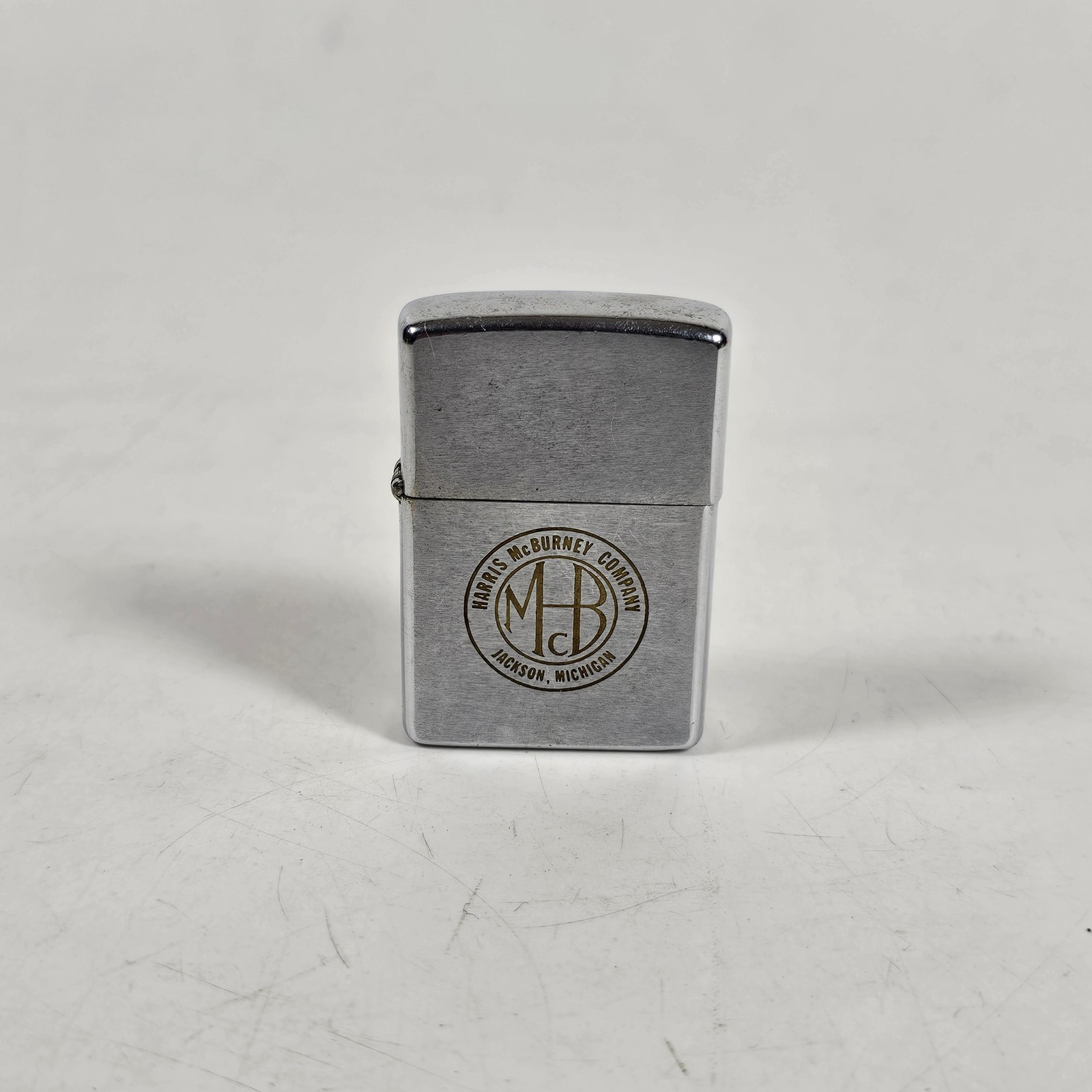 Vintage Zippo Lighter Harris McBurney Company Jackson MI Logo Chrome