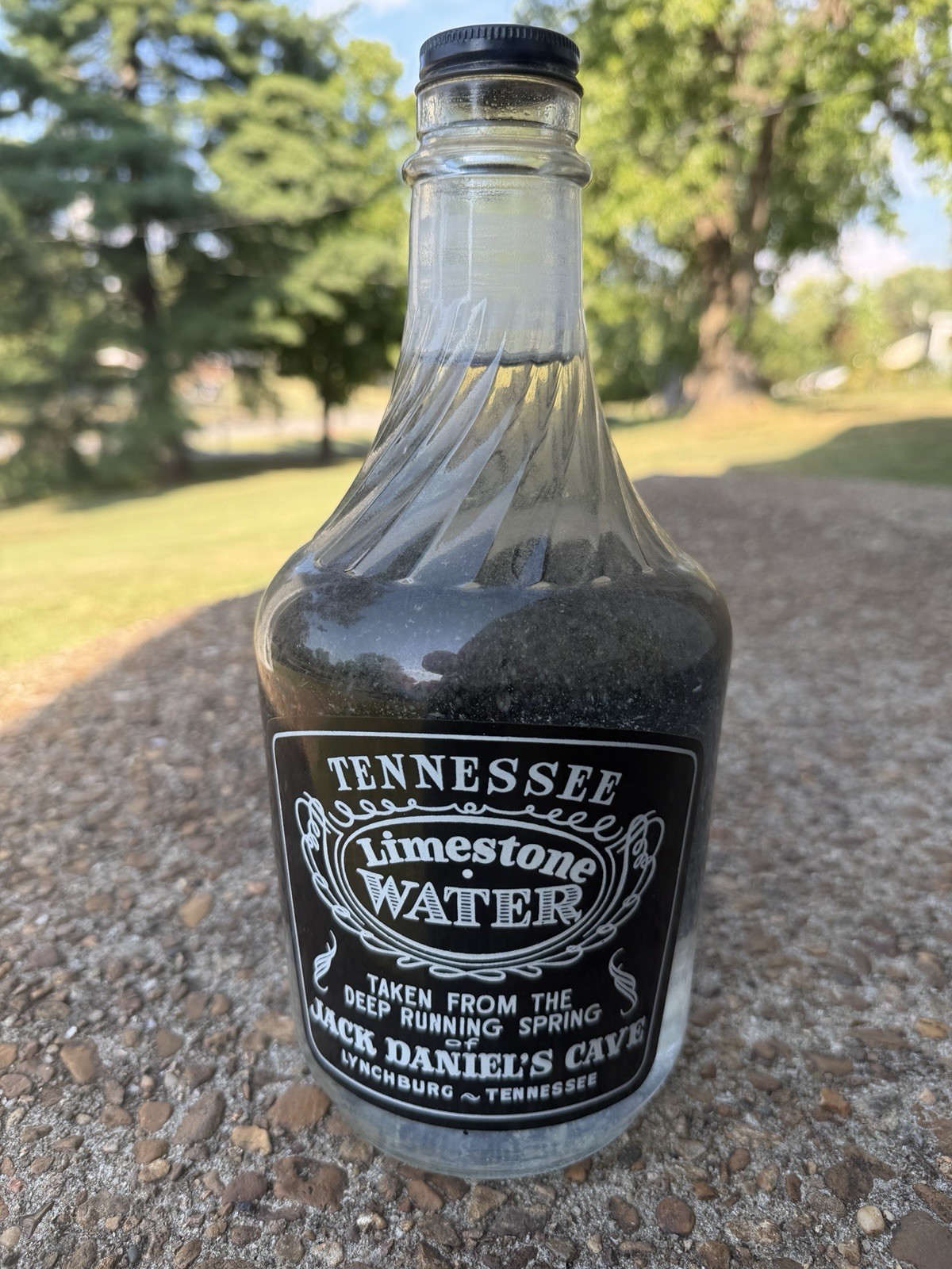 JACK DANIEL’S TENNESSEE LIMESTONE WATER BOTTLE FULL WITH LID 1/2 GALLON 1972