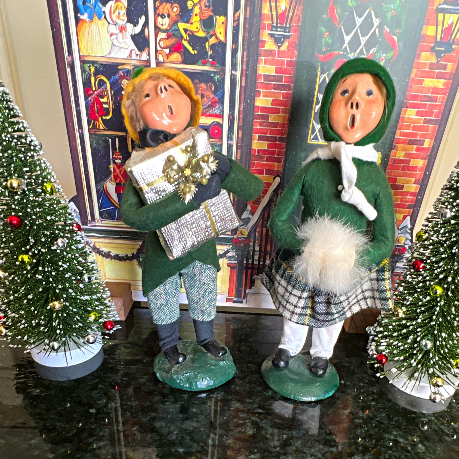 Vintage Christmas Caroler boy and girl w/ green outfits plaid fabric, bumpy base
