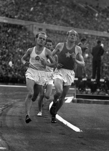 Czechoslovakian athlete Emil Zatopek Kovacs Hungary compete a run - 1950s Photo
