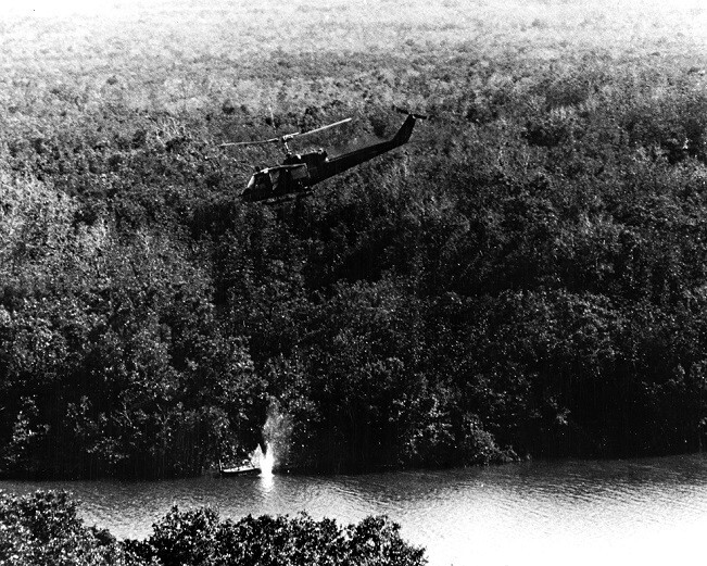River Patrol Huey Helicopter fires rocket at enemy 8x10 Vietnam War Photo 771