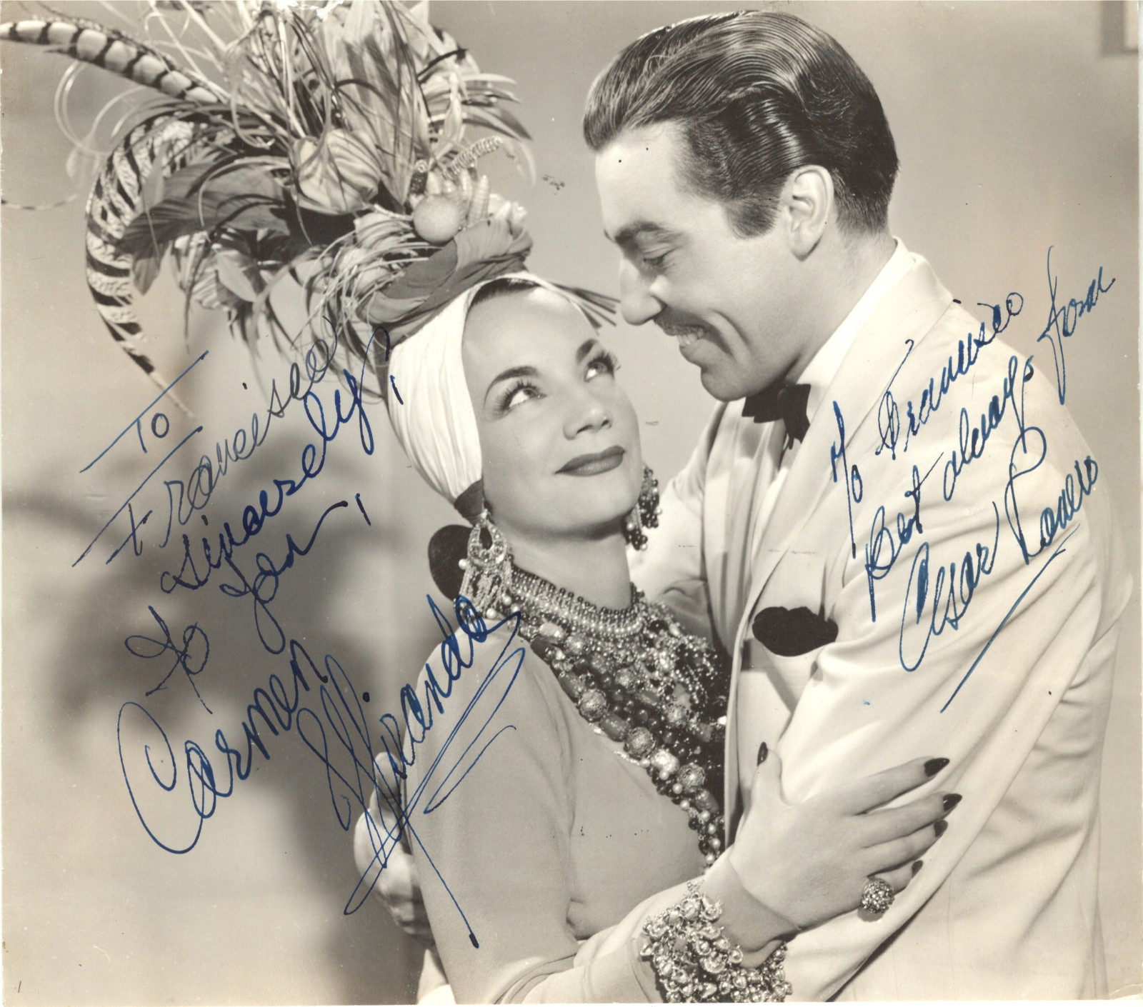 BRAZILIAN BOMBSHELL CARMEN MIRANDA & CESAR ROMERO, SIGNED VINTAGE STUDIO PHOTO.