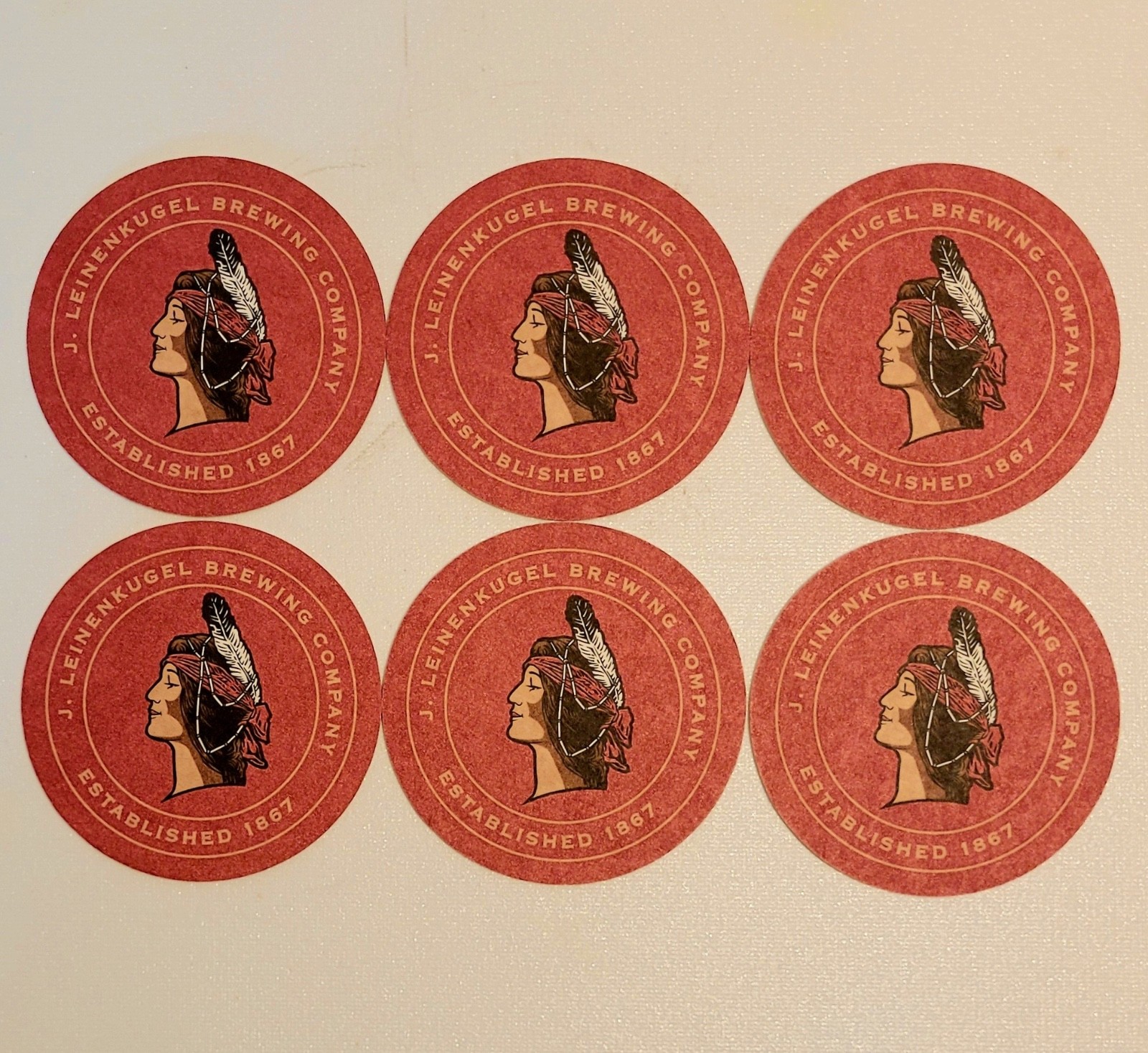 6 LEINENKUGEL\'S BEER COASTERS UNUSED WITH LEINIE\'S MAIDEN FROM CHIPPEWA FALLS, W