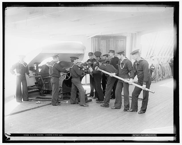 Photo:U.S.S. Newark, loading 6-inch gun