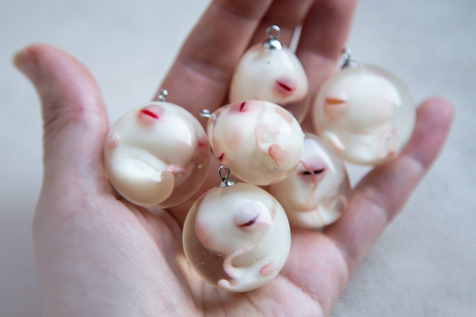 Pendants with embyos (Cthulhu, Axolotl, Dragon), different colors possible