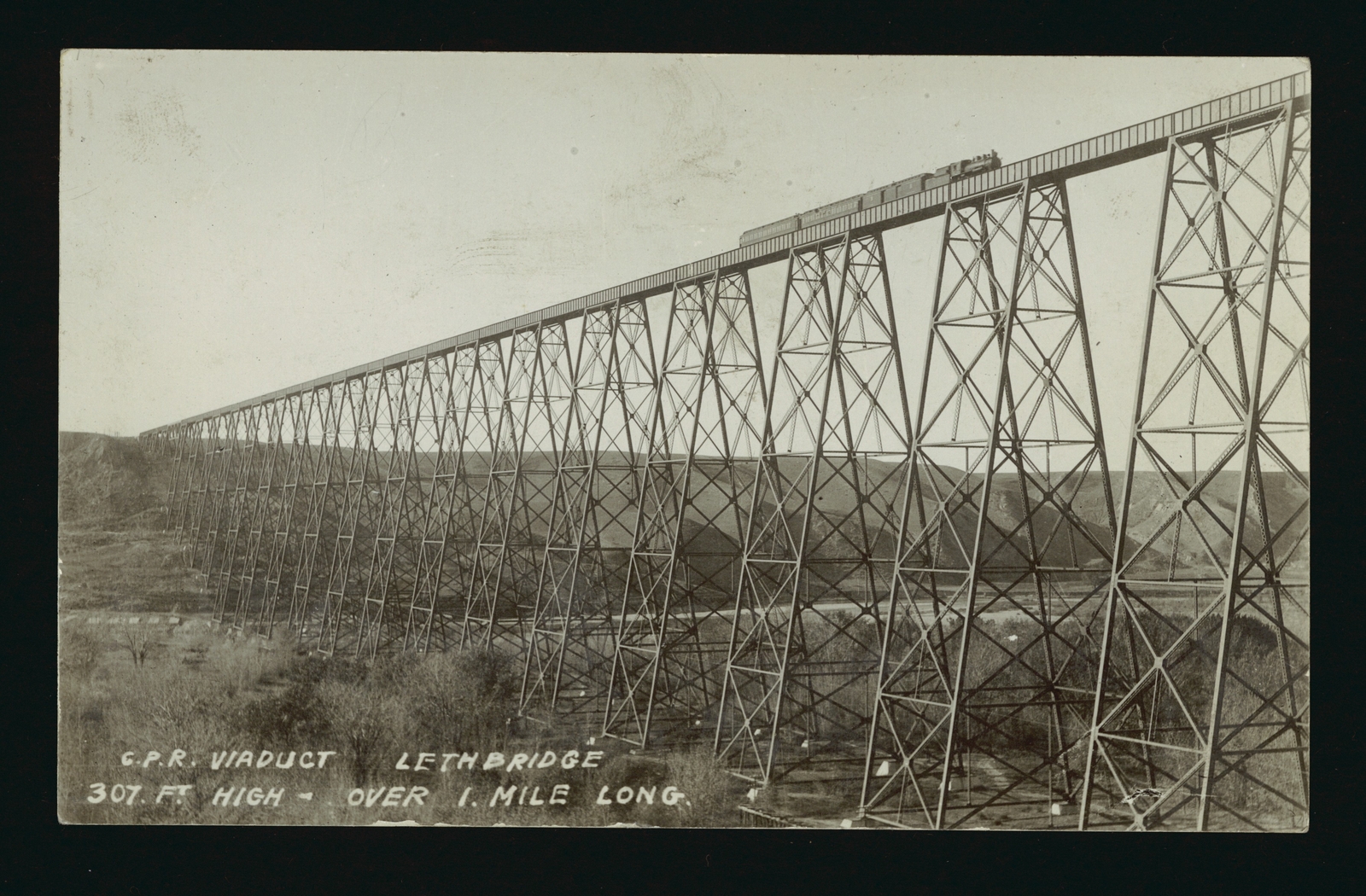 CPR Viaduct Lethbridge - A panoramic view of a train crossing the - Old Photo