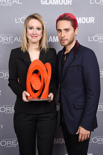 Honoree Elizabeth Holmes poses backstage with her award actor Jare - Old Photo 1