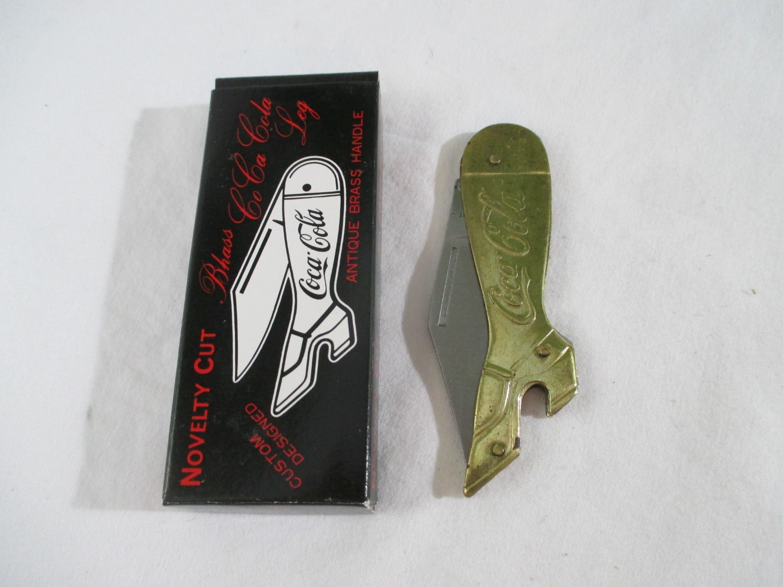 Vintage Novelty Cut Brass Coca Cola Leg Knife