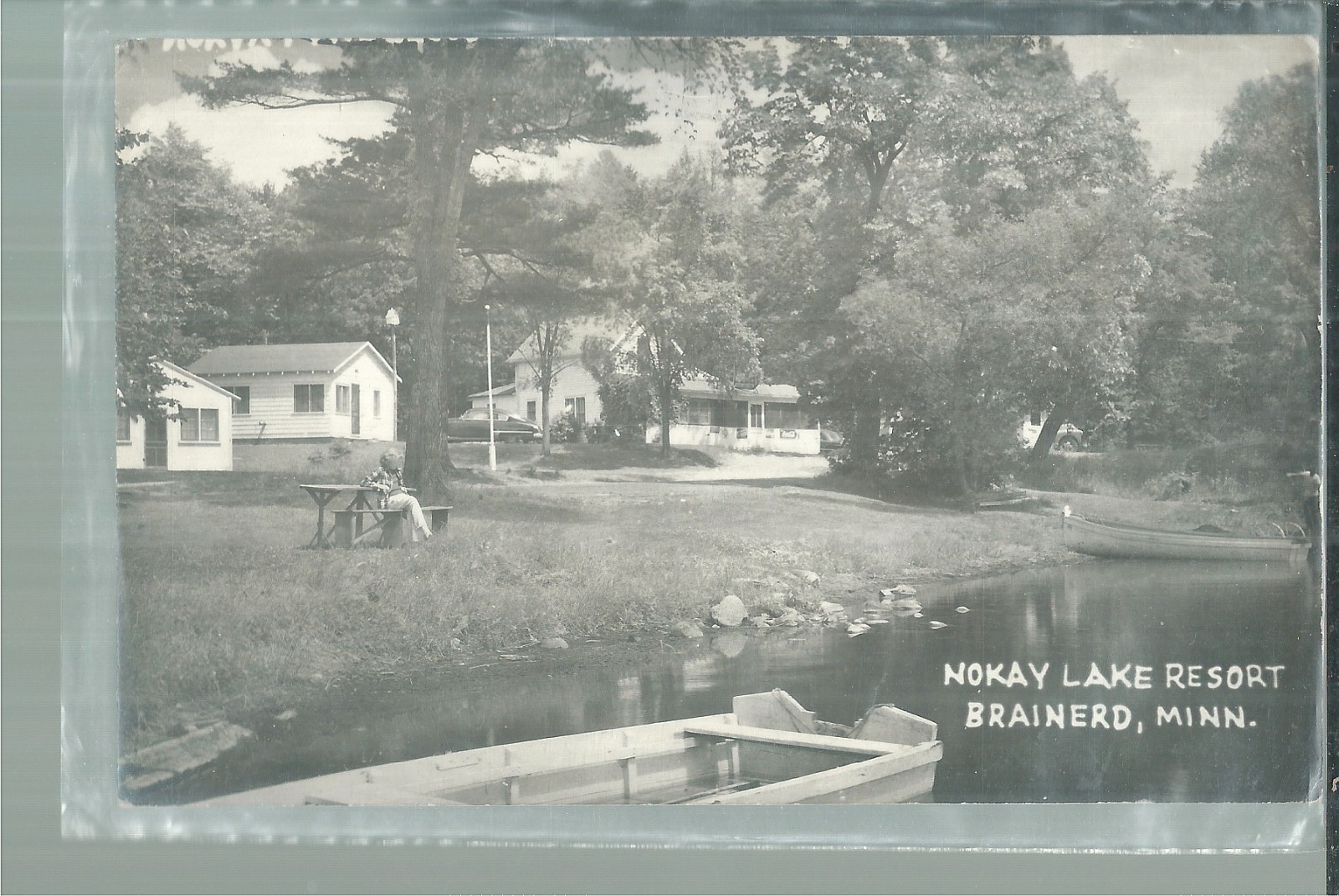 NICE RPPC VIEW OF THE COTTAGES AT NOKAY LAKE RESOR IN BRAINERD, MN 1952
