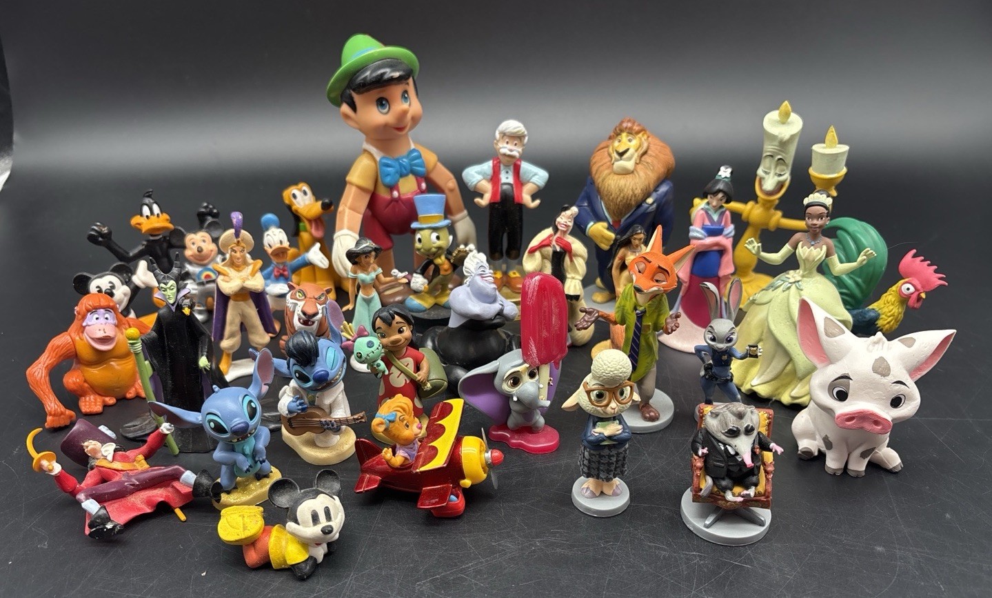 Disney Figure Lot 33 Mickey Mouse Stitch Zootopia Pinocchio Villains Daffy Duck