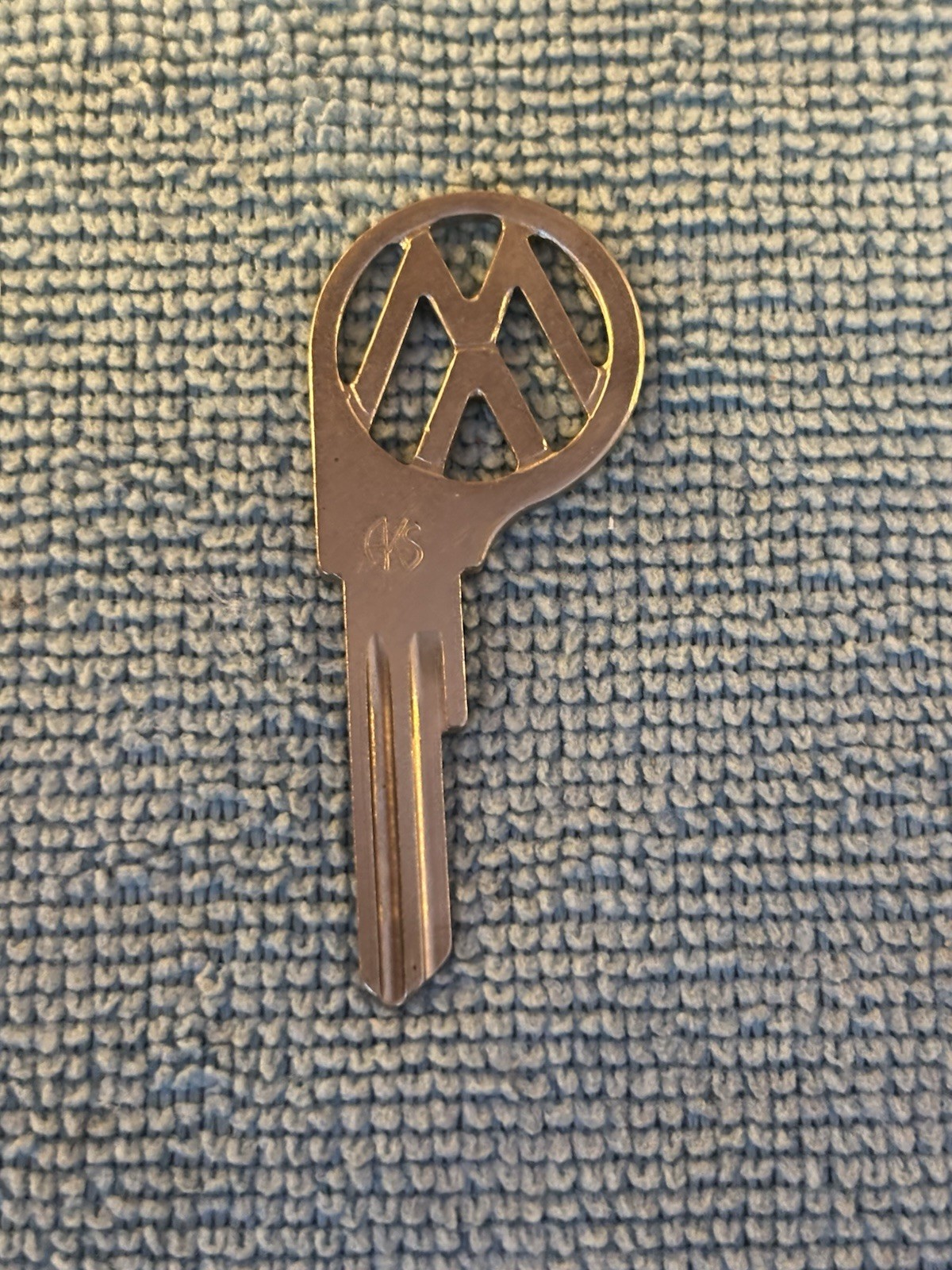 Uncut vintage Volkswagen logo key blank unnotched blade stamped with 