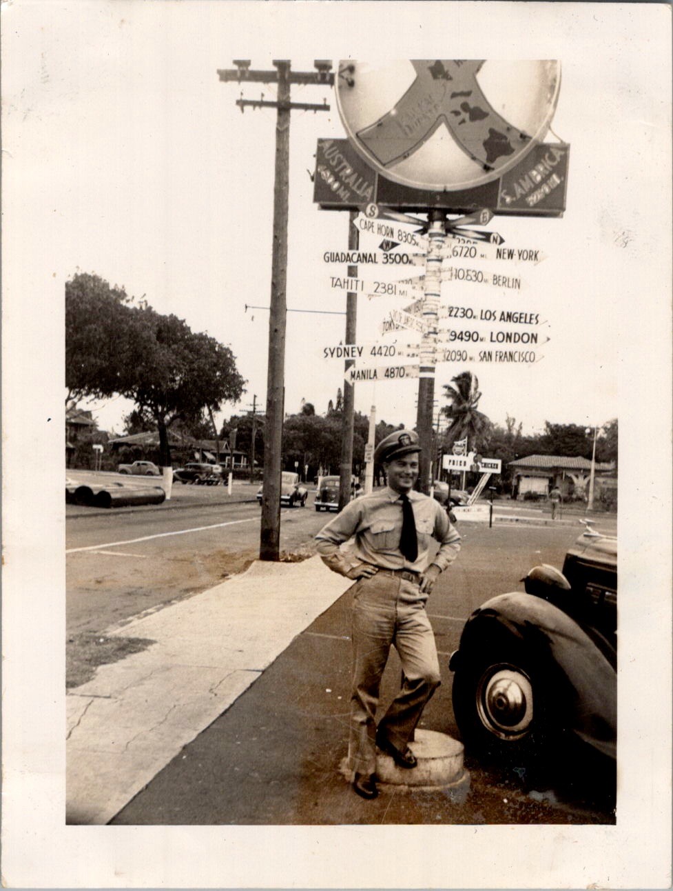 WWII US Serviceman at Crossroads of the Pacific Signpost Photograph Hawaii 1940s