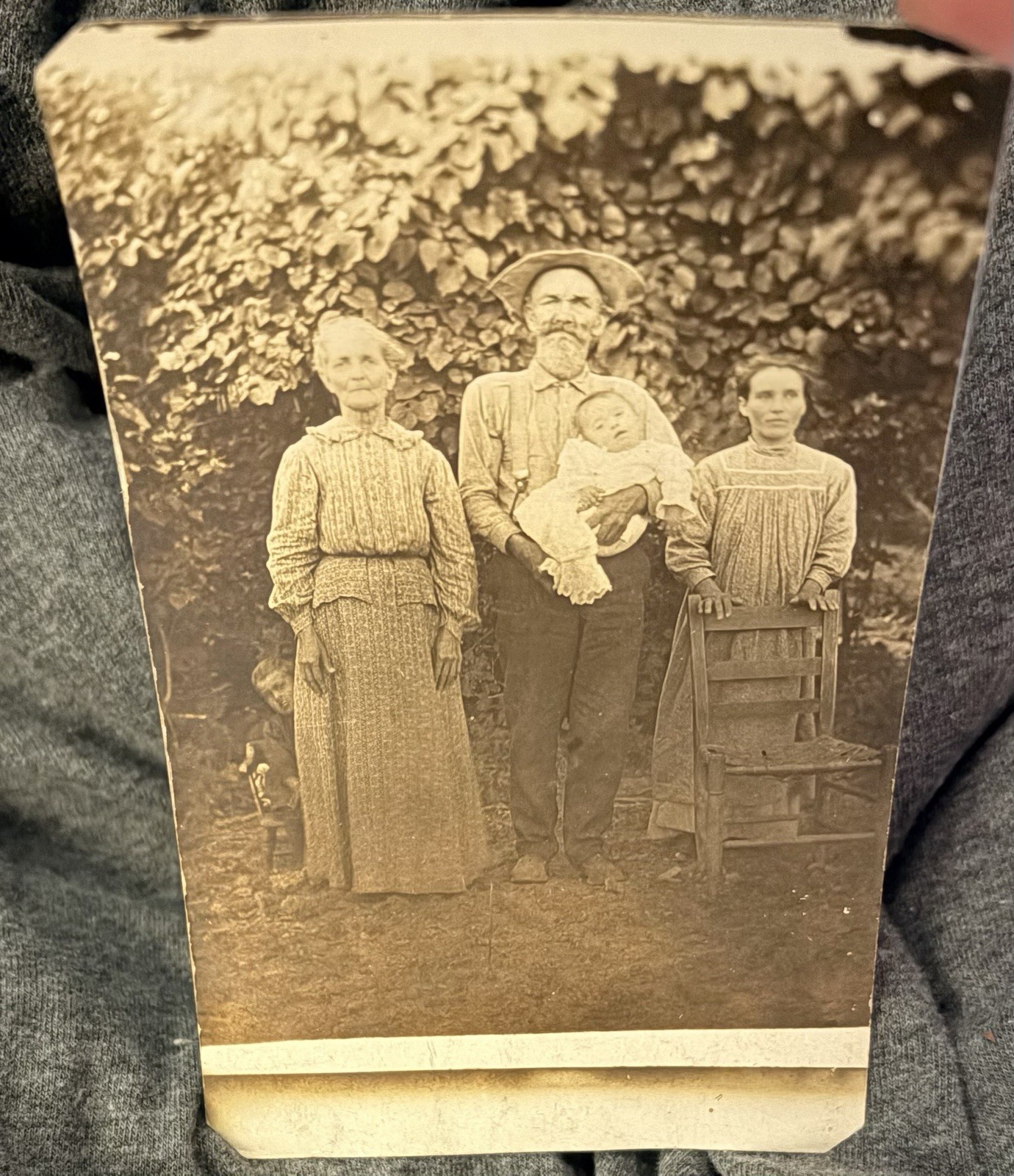RPPC Vintage Postcard Family Baby Post Mortem Down Syndrome ? Child Peeking Out