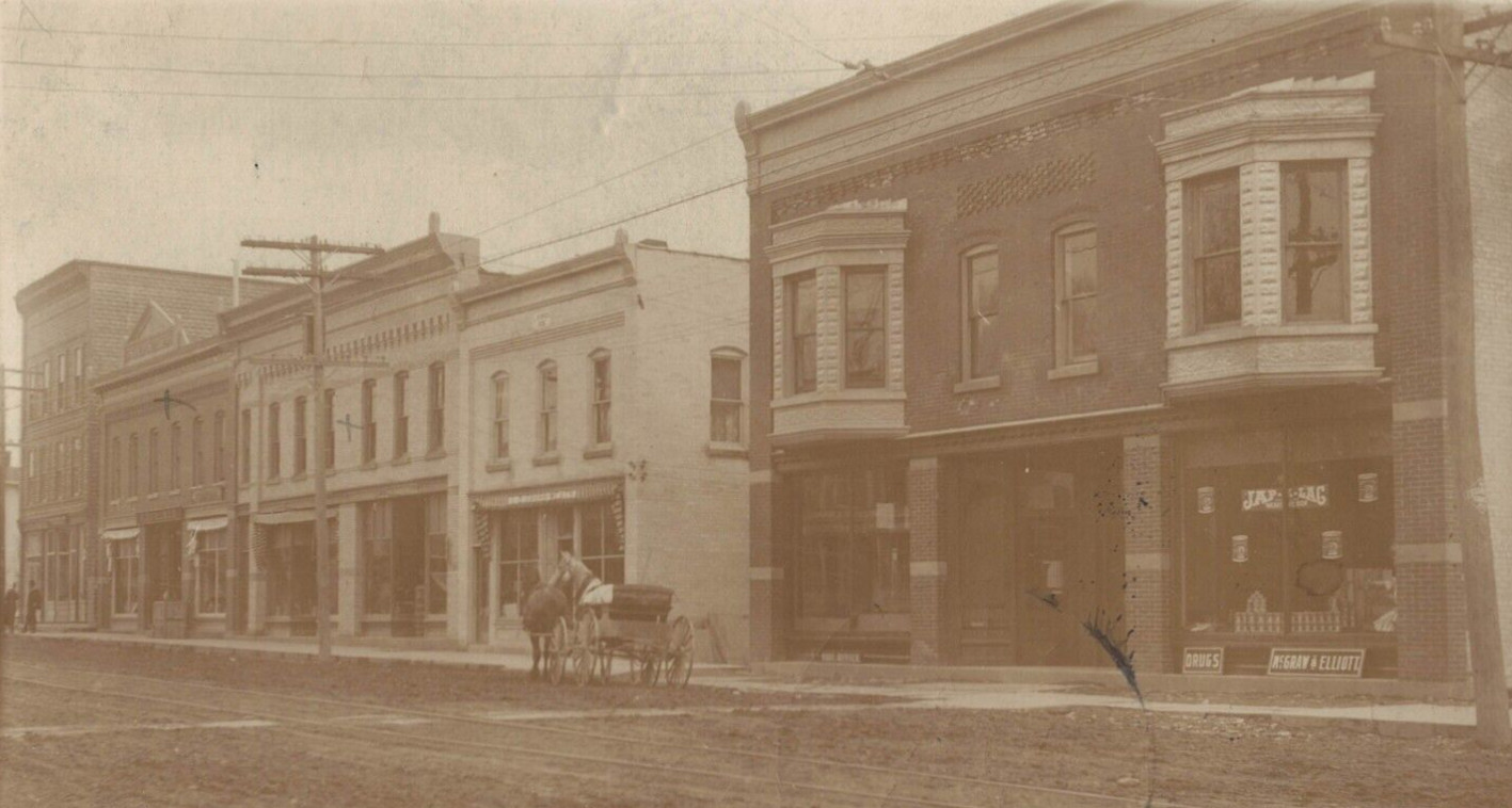 C.1907 RPPC New Building After Fire Horse Carriage Drugs Jap-A-Lag McGraw Elliot