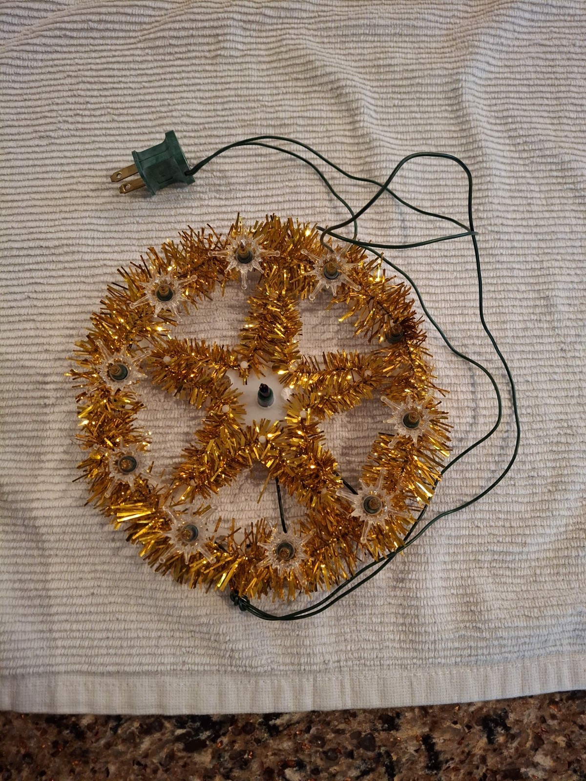 Vintage Noma Christmas tree topper. Gold tinsel light