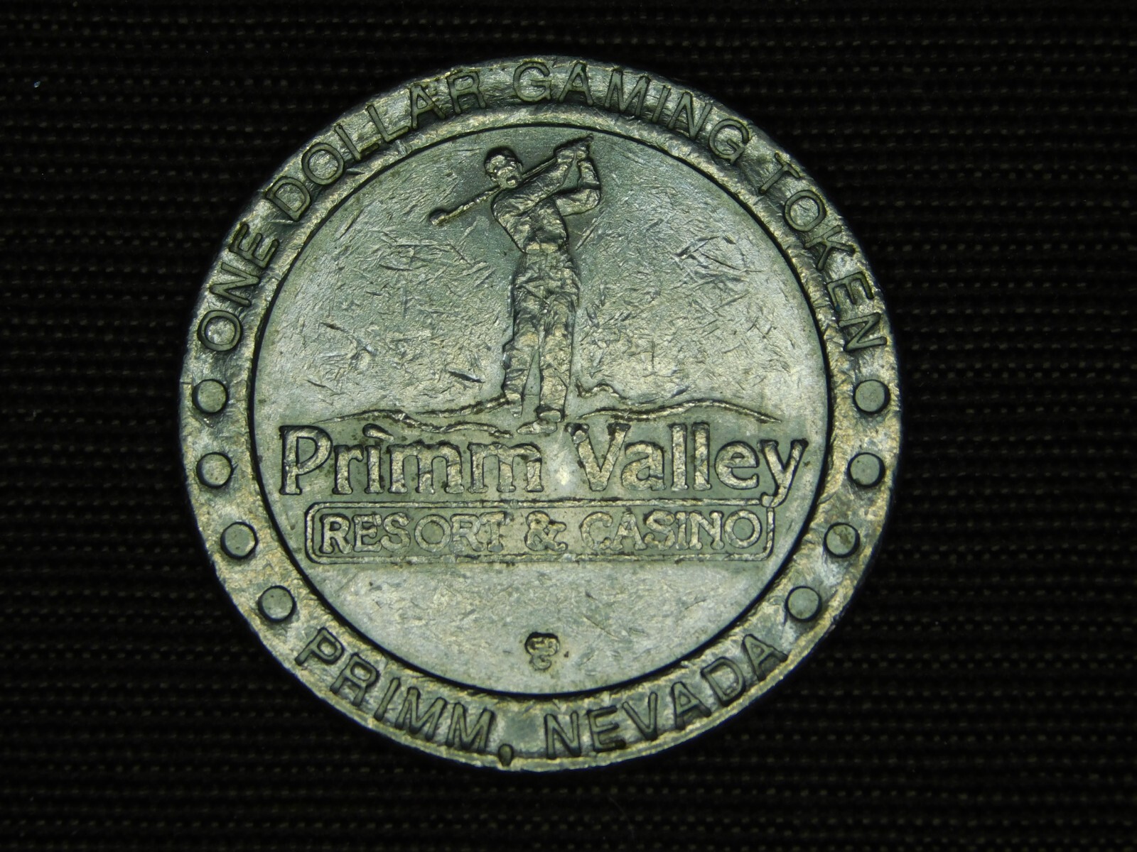VINTAGE ONE DOLLAR GAMING TOKEN PRIMM VALLEY NEVADA CASINO & RESORT
