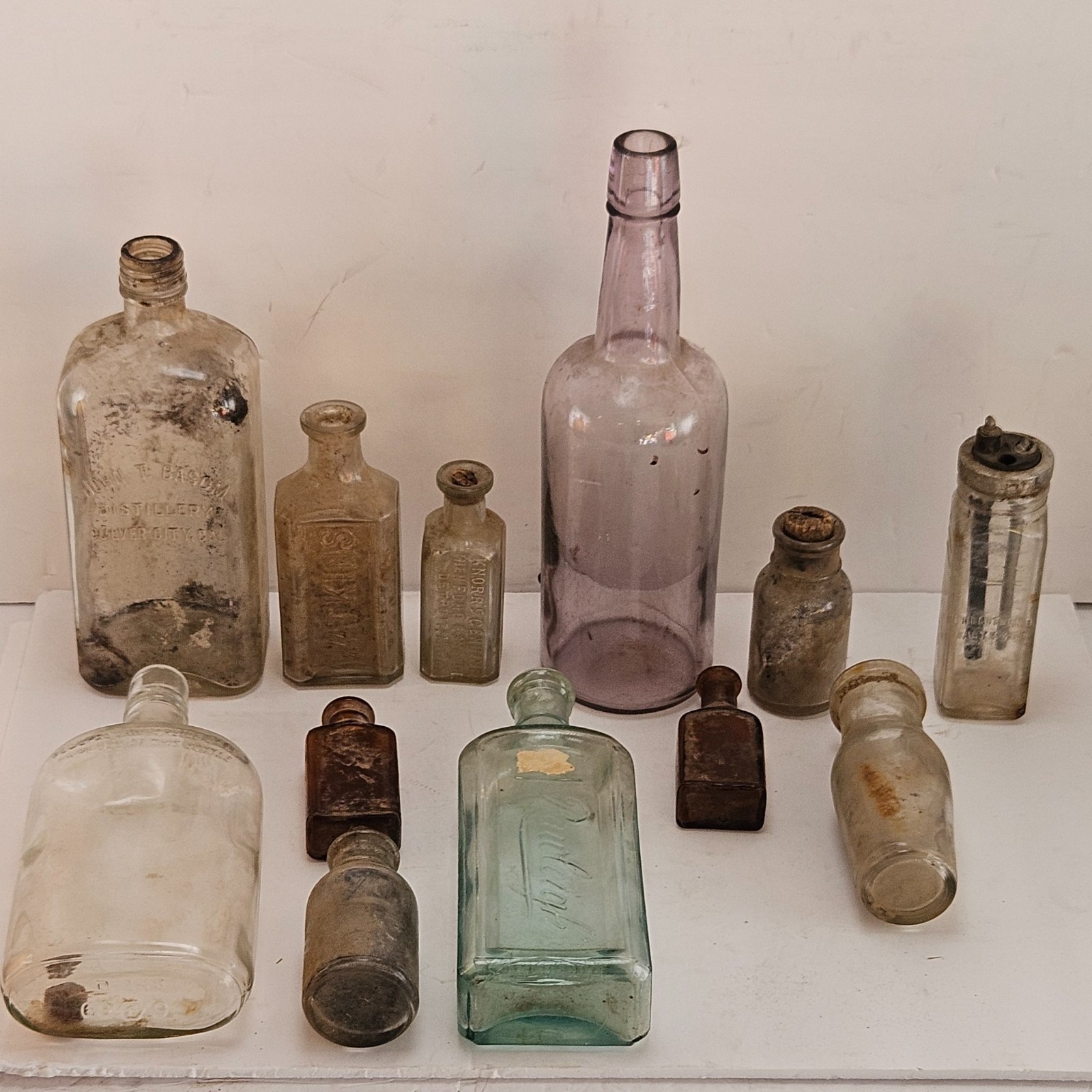 12 Antique Dug Glass Bottles Lot Purple Desert Glass Basom Distillery 1930s