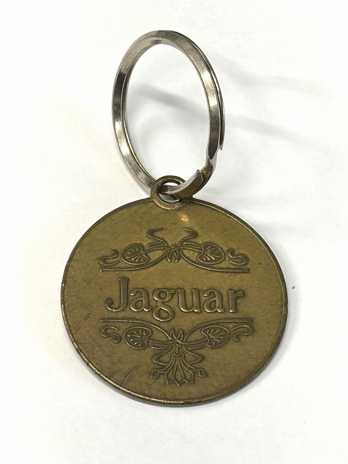 Vintage Jaguar 1978 Stamped Lowell Sigmund Keychain Fob 
