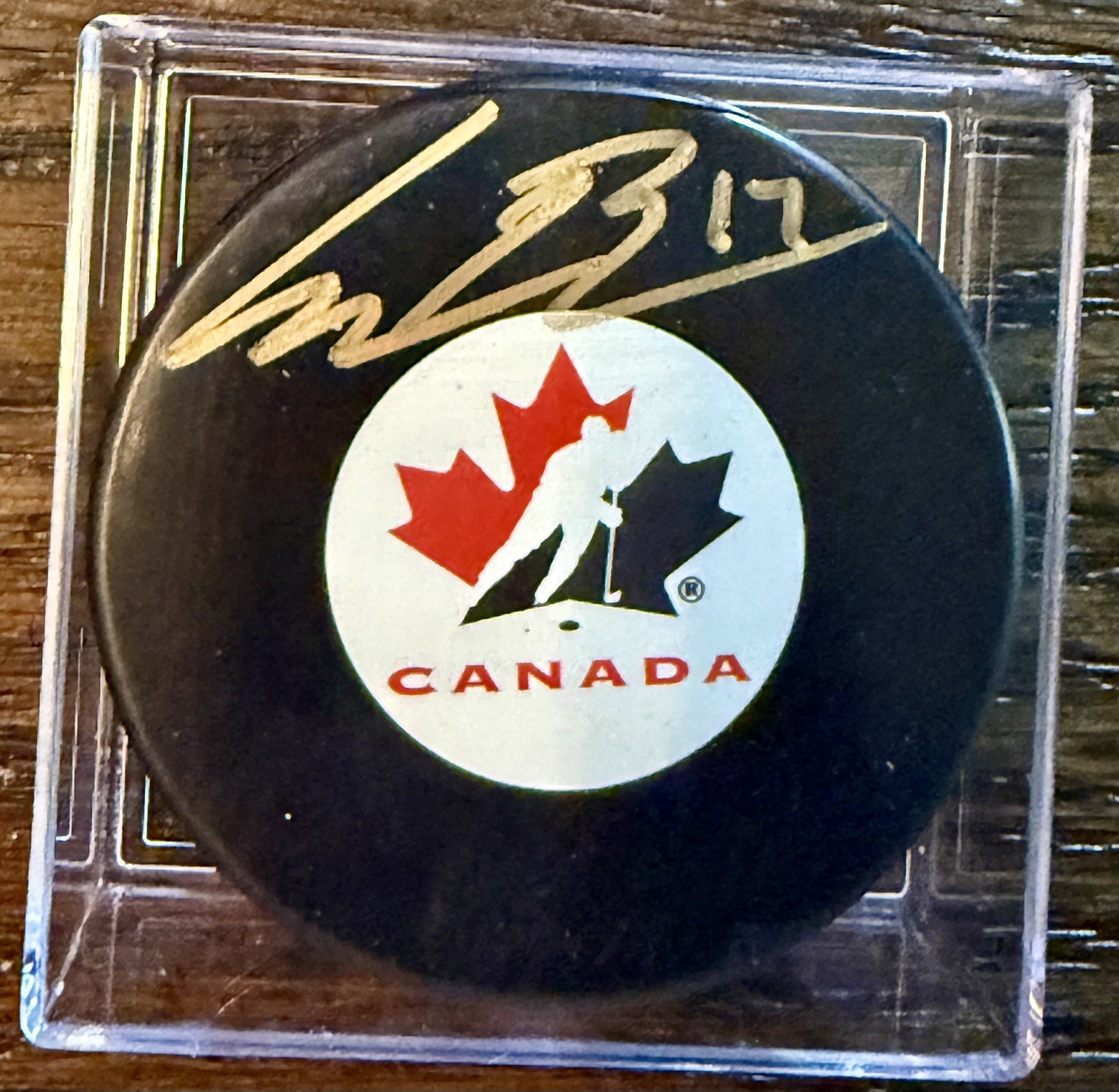 Connor Bedard #17 Autographed Canada Souvenir Puck - A J Sports COA / Blackhawks