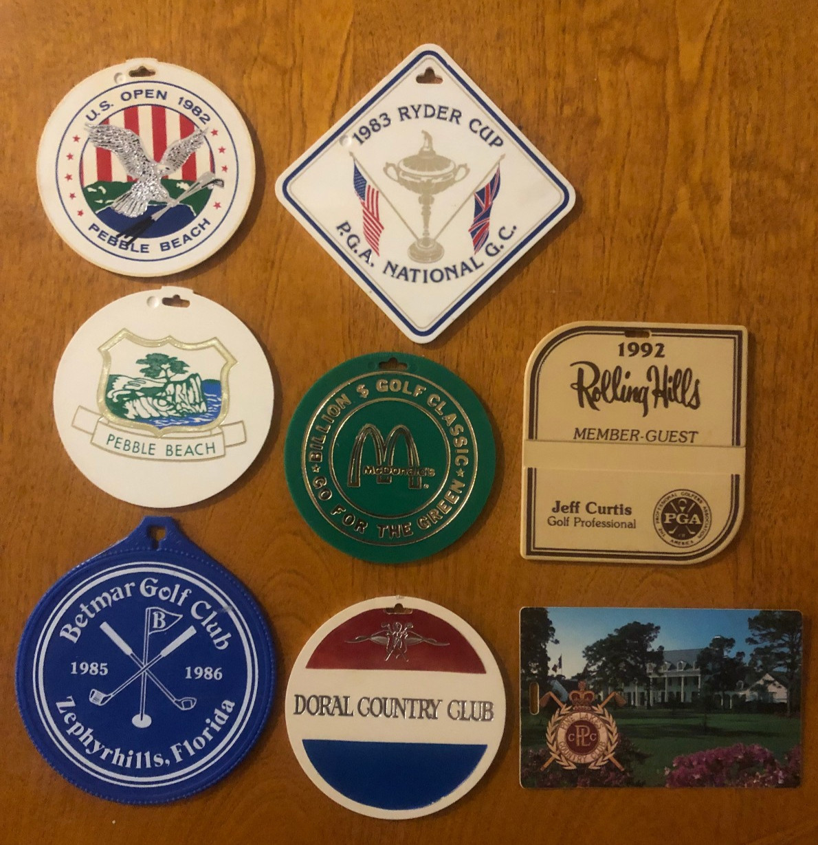 Lot of 8 vintage golf bag tags PEBBLE BEACH DORAL CC BETMAR US OPEN RYDER CUP