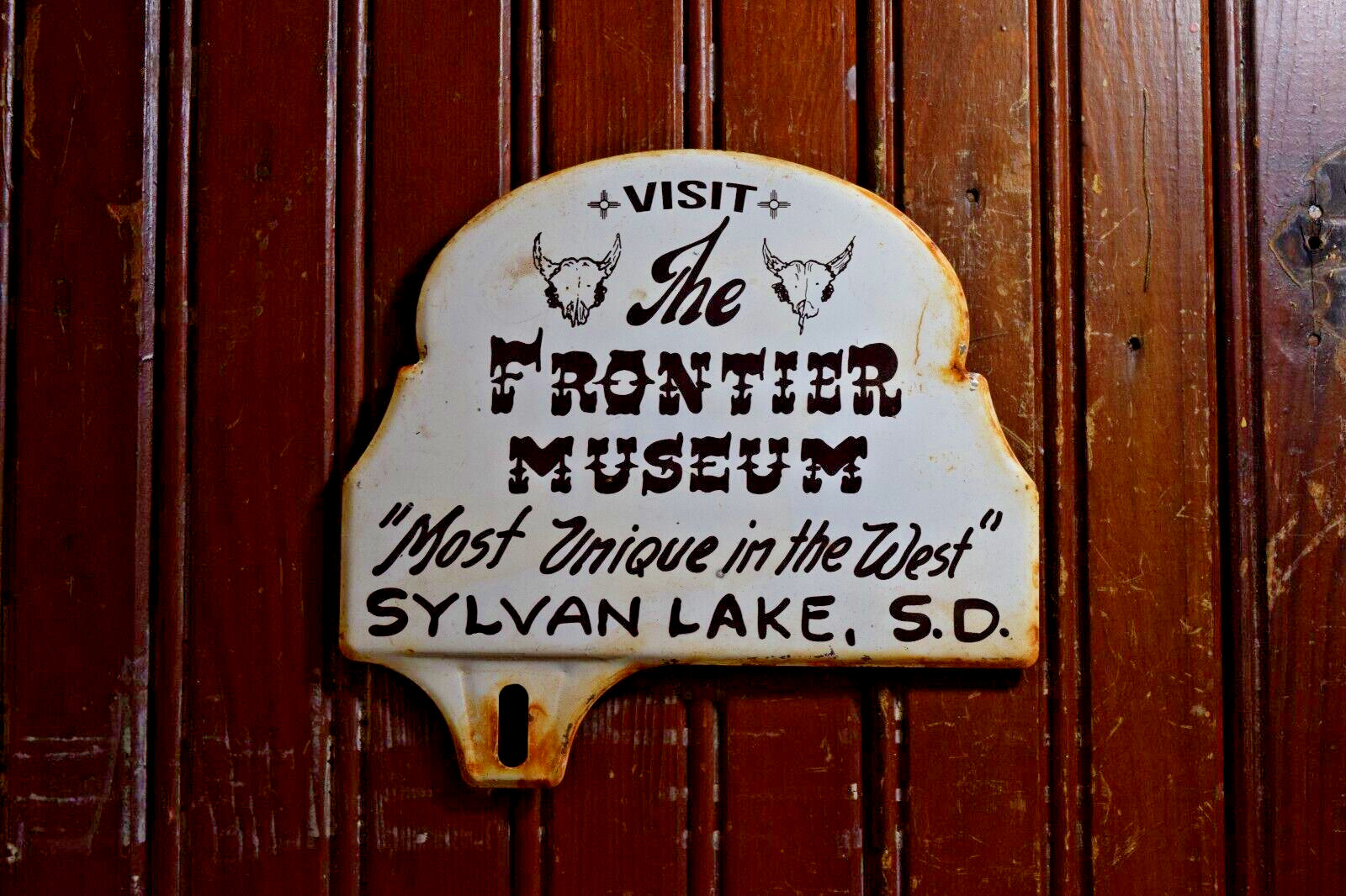 1950s FRONTIER MUSEUM SYLVAN LAKE SOUTH DAKOTA STAMPED PAINTED METAL TOPPER SIGN