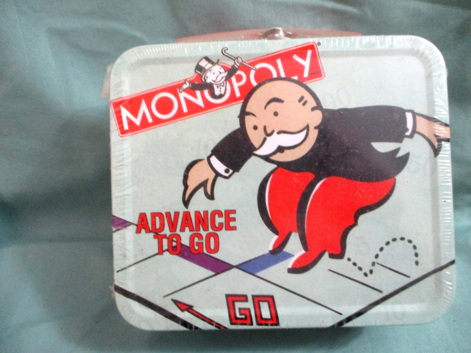 New 2000 Hasbro Monopoly Advance to GO Mini Metal Lunch Box Red Handle sealed