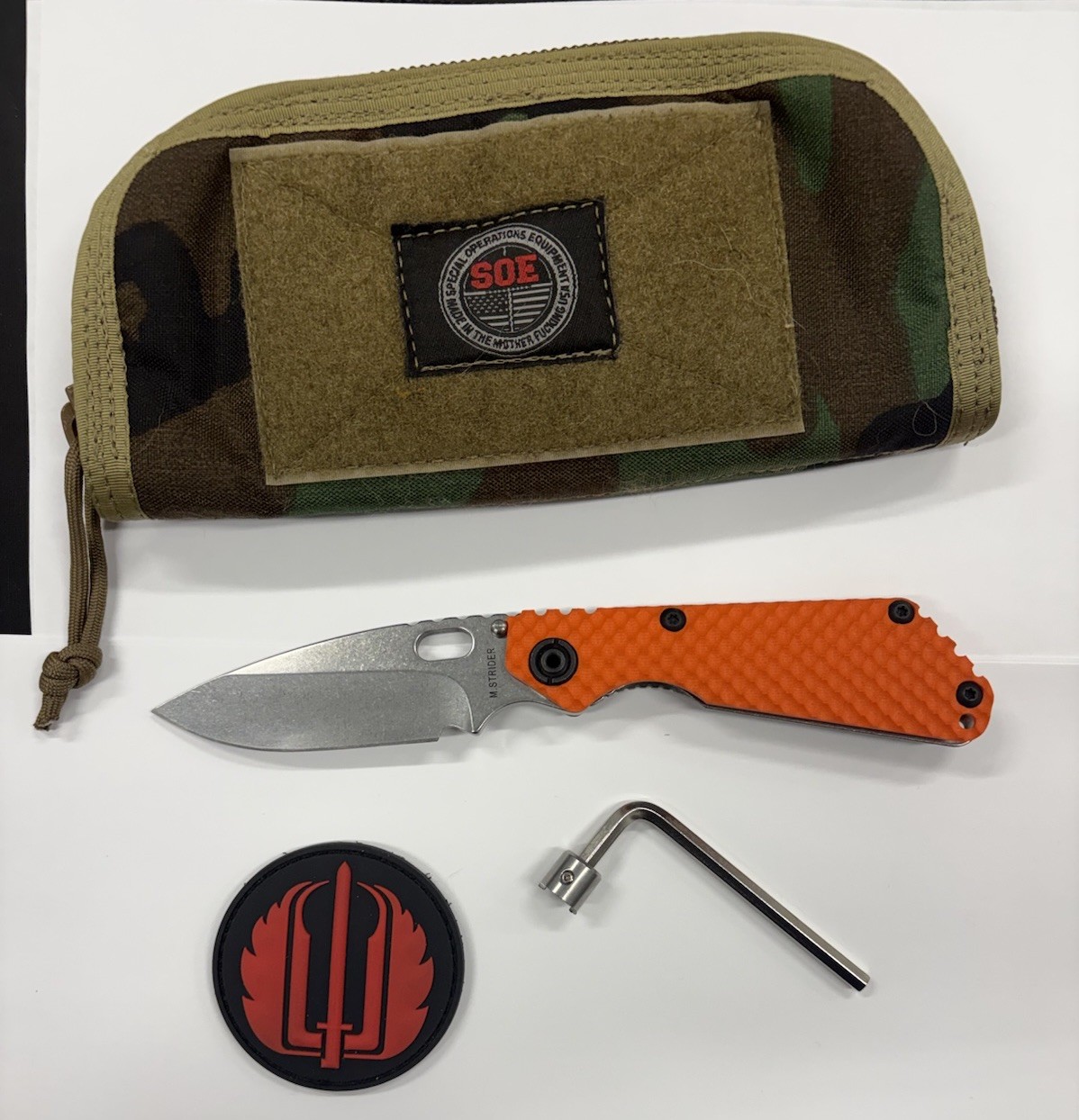 Strider Knives SnG DGG Satin Magnacut Blade Orange G10 Show Side With Extras