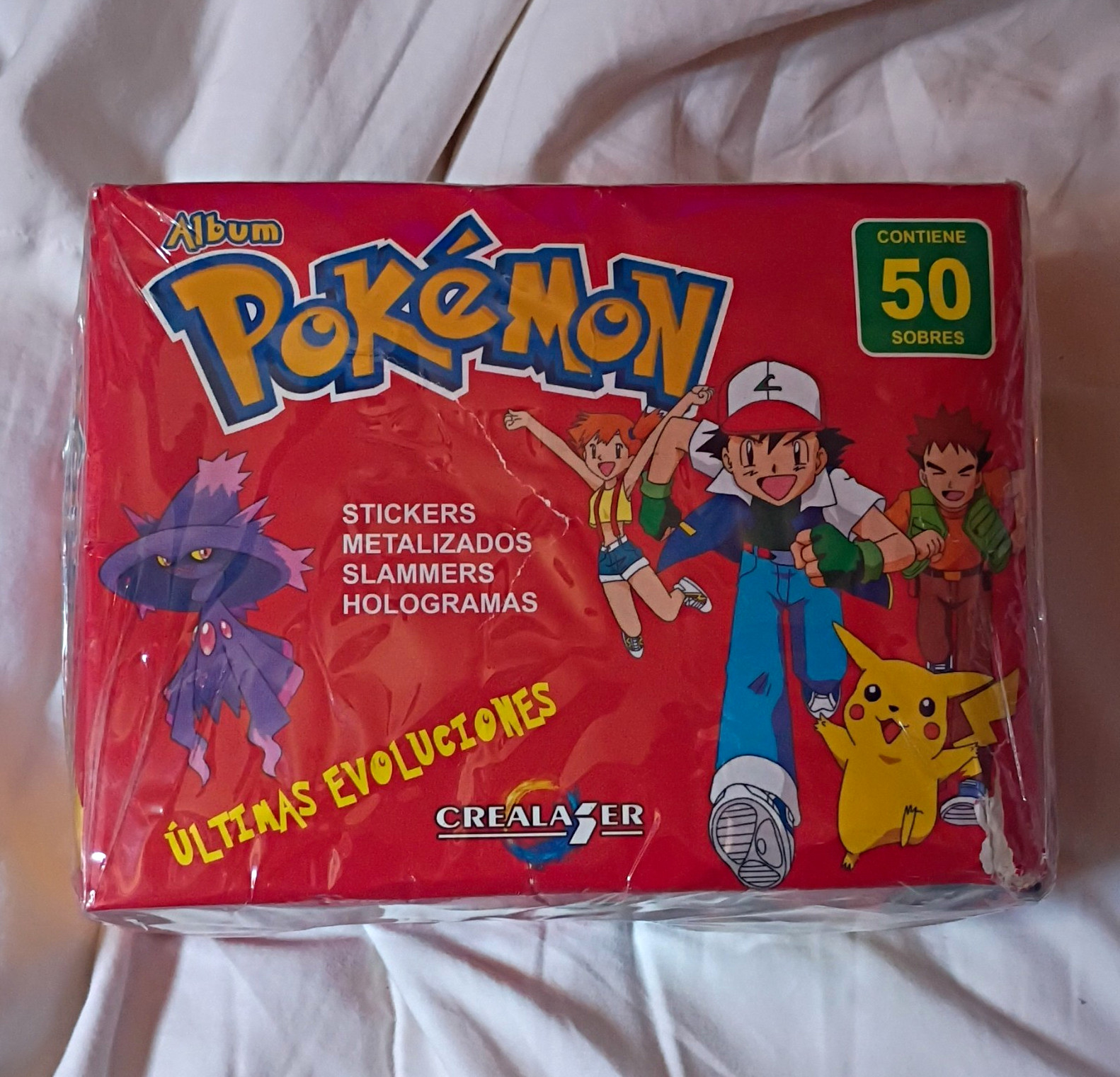 Crealaser Pokémon Últimas Evoluciones Sticker Album Set - 50 Sobres Español