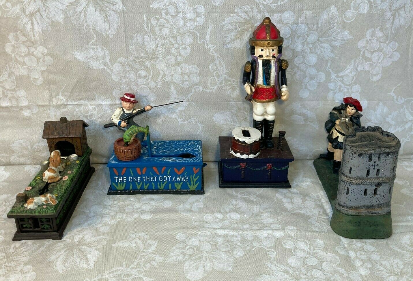 4 Vintage Cast Iron Reproduction Coin Banks Nicely Painted and Decorated